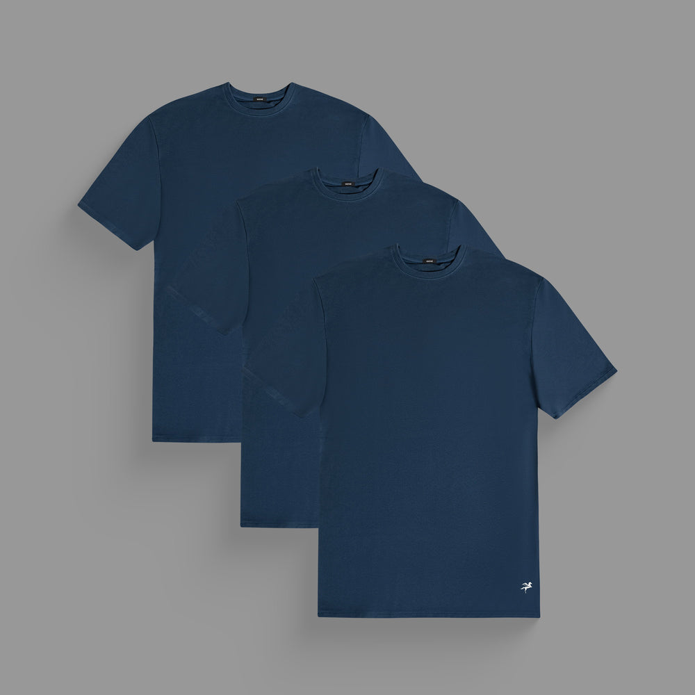 Three navy blue T-shirts on a grey background.