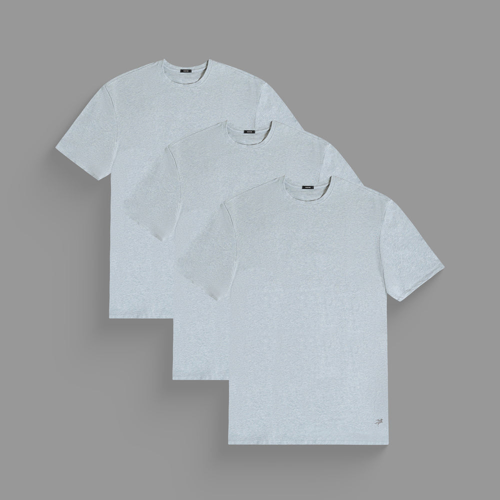 Three light gray T-shirts overlapping on a gray background.