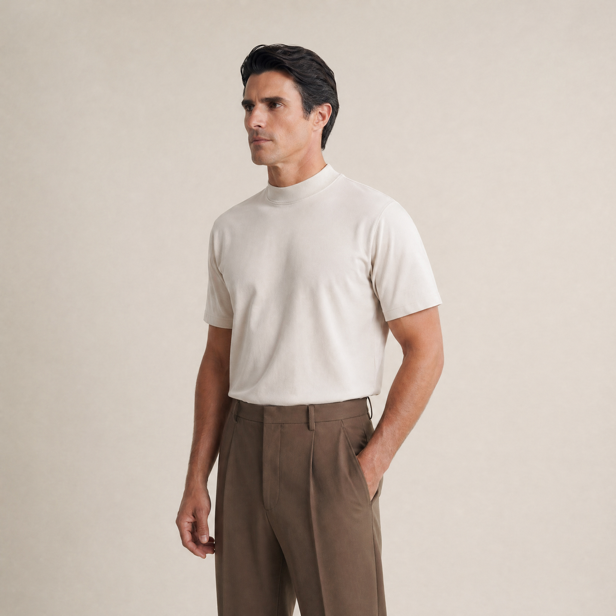 Man wearing a Bone short-sleeve shirt against a beige background model Kive in Bone