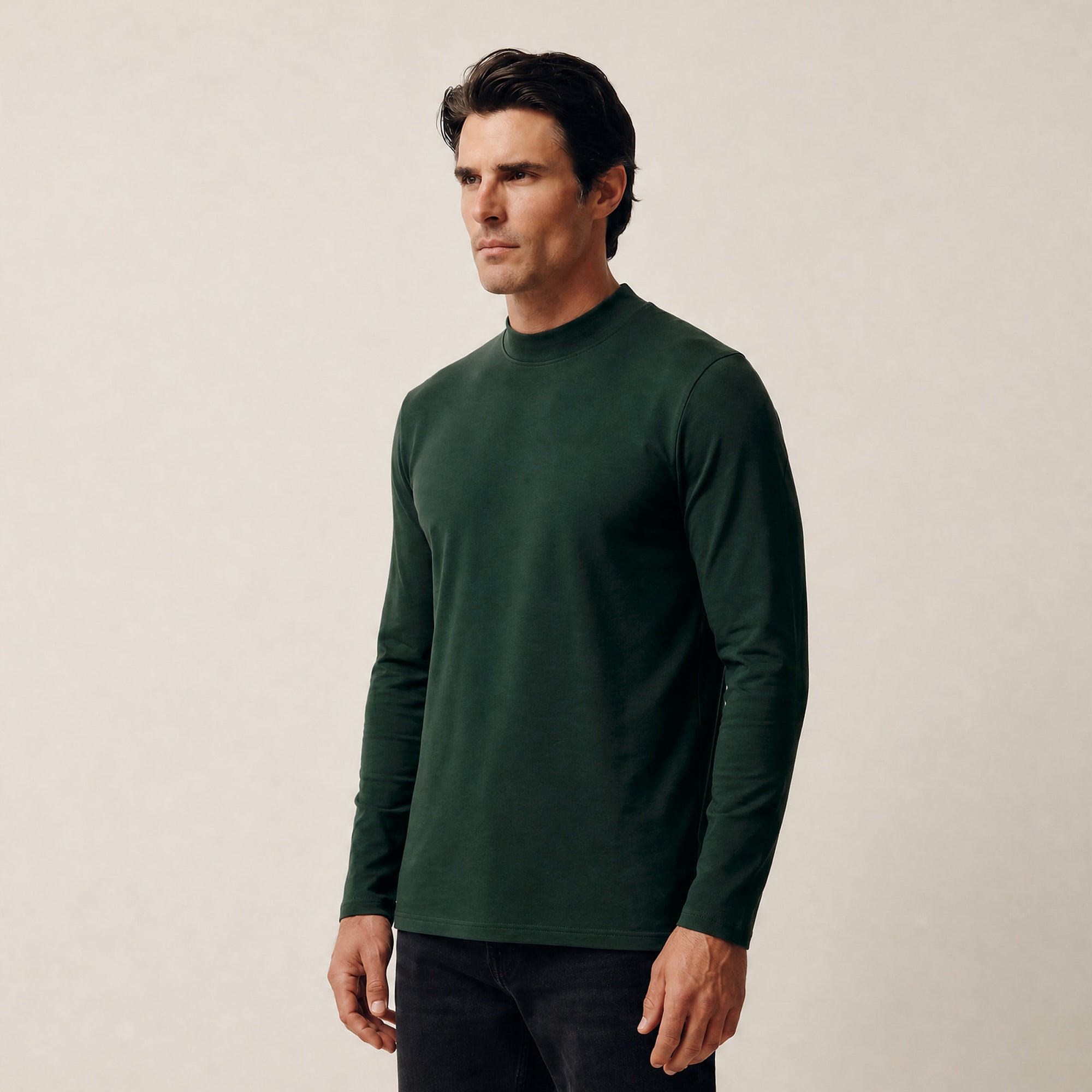 Man wearing a Pine Grove long-sleeve shirt against a beige background model Kive in Pine Grove