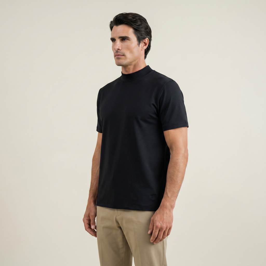Man wearing a black short-sleeve shirt against a beige background model Kive in black