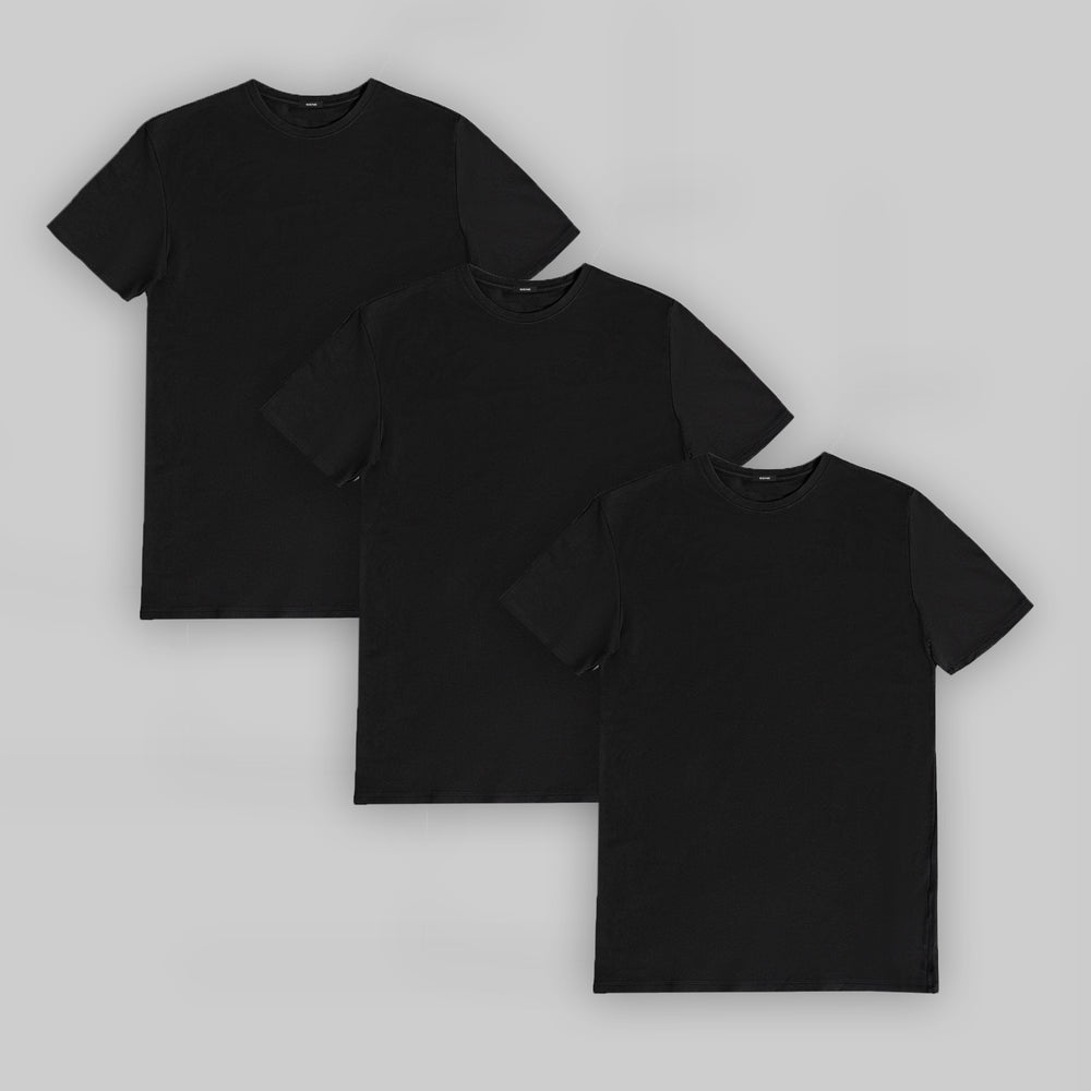 Three black t-shirts arranged on a gray background.