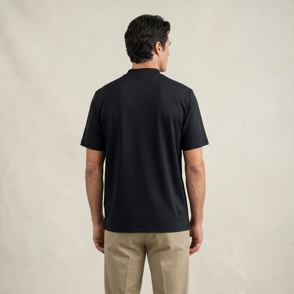 Man wearing a black short-sleeve shirt against a beige background model Kive in black