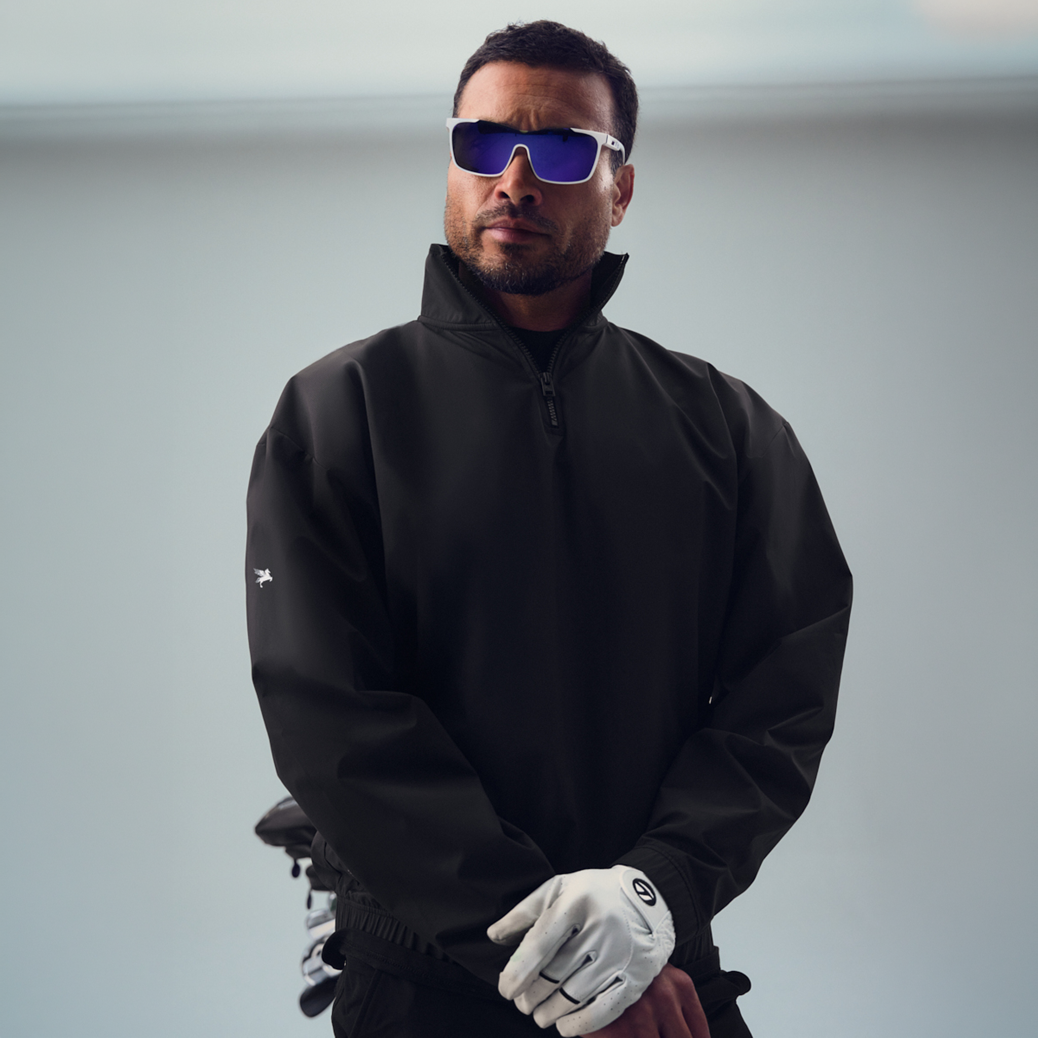 bespoke custom-fit golf nylon rain shell water resistant wind breaker quarter zip model chad in black