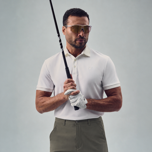 chad wearing bespoke golf polo model chad in white