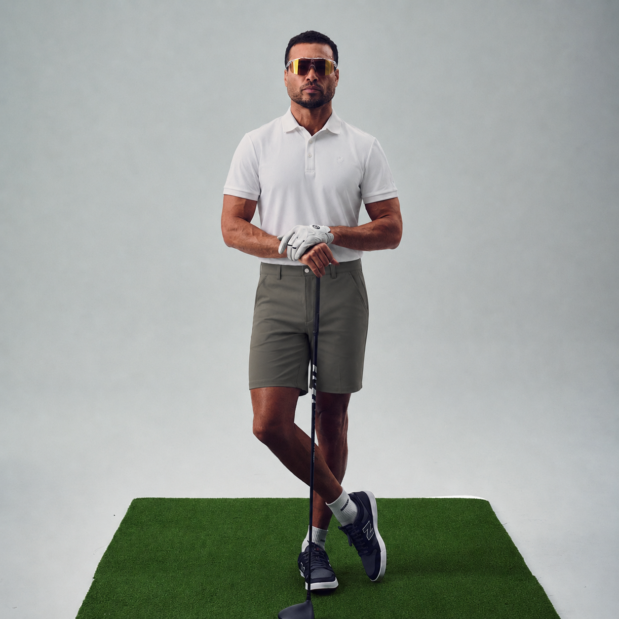 chad wearing bespoke golf polo model chad in white
