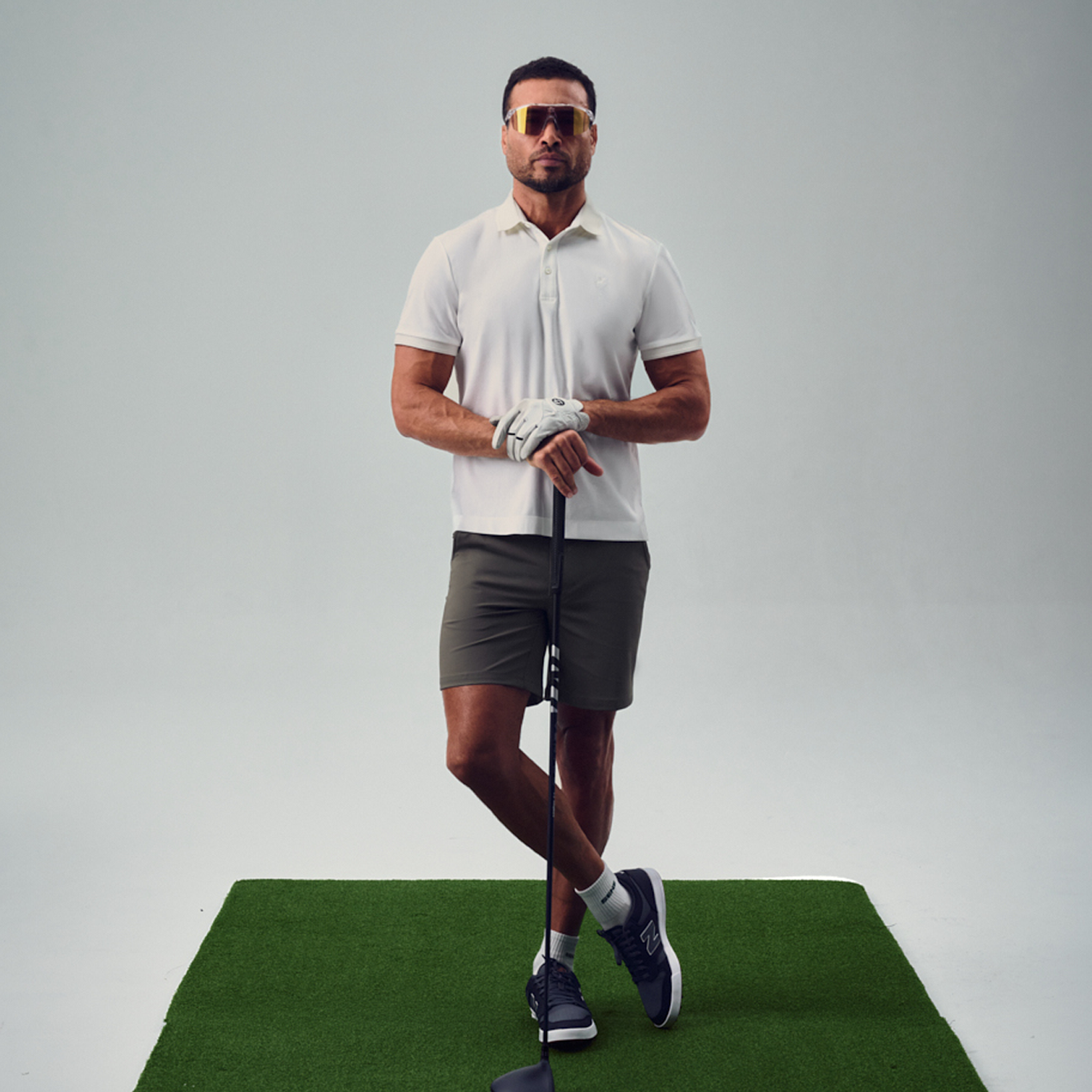 chad wearing bespoke golf polo model chad in white
