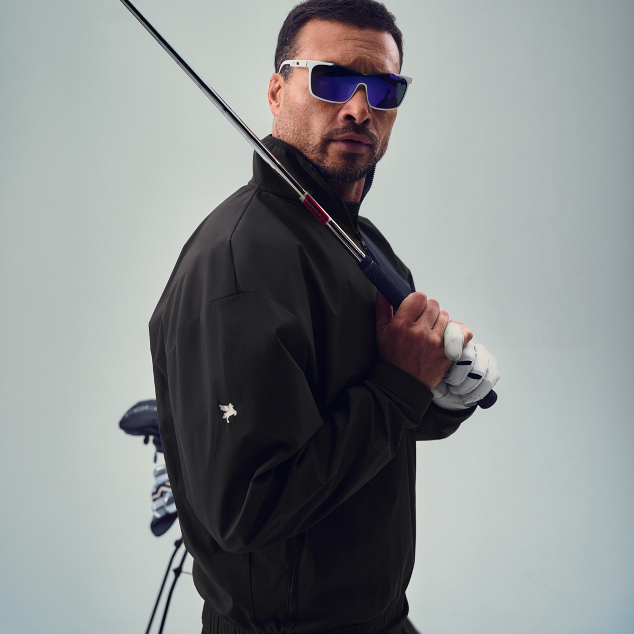 bespoke custom-fit golf nylon rain shell water resistant wind breaker quarter zip model chad in black