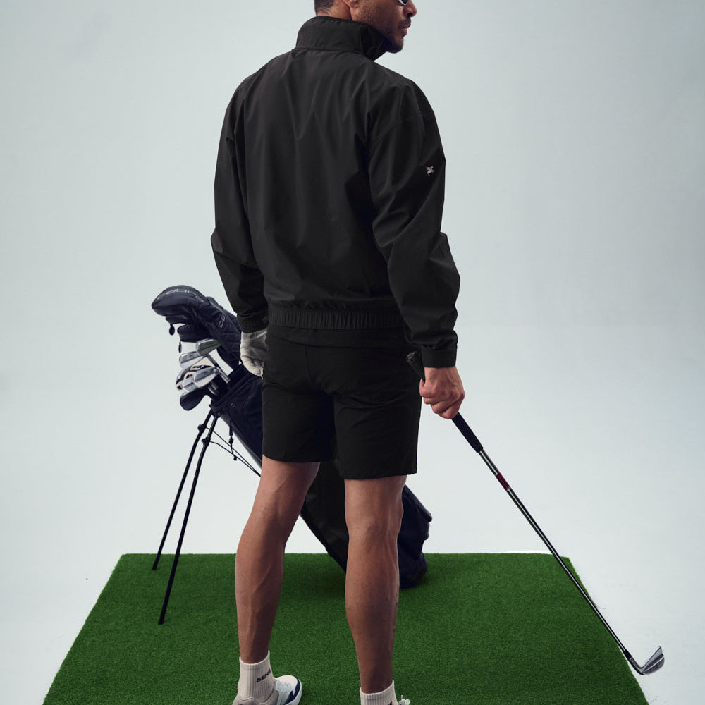 bespoke custom-fit golf nylon rain shell water resistant wind breaker quarter zip model chad in black