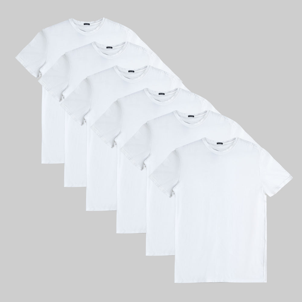 Six white t-shirts arranged in a diagonal pattern on a gray background.