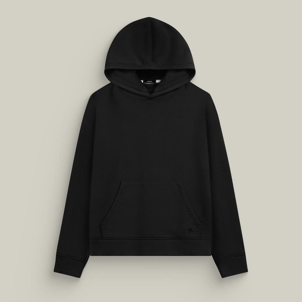 Black hoodie on a beige background model Kive in Black