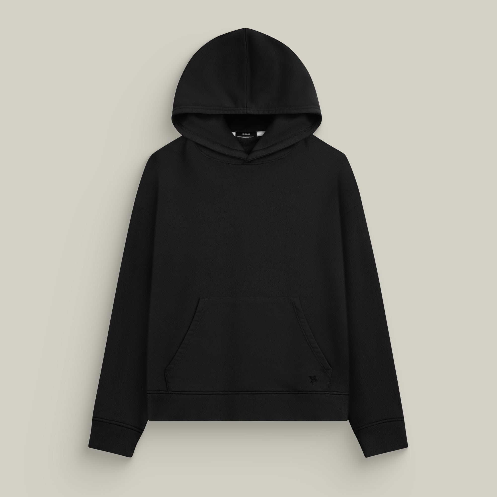 Black hoodie on a beige background model Kive in Black