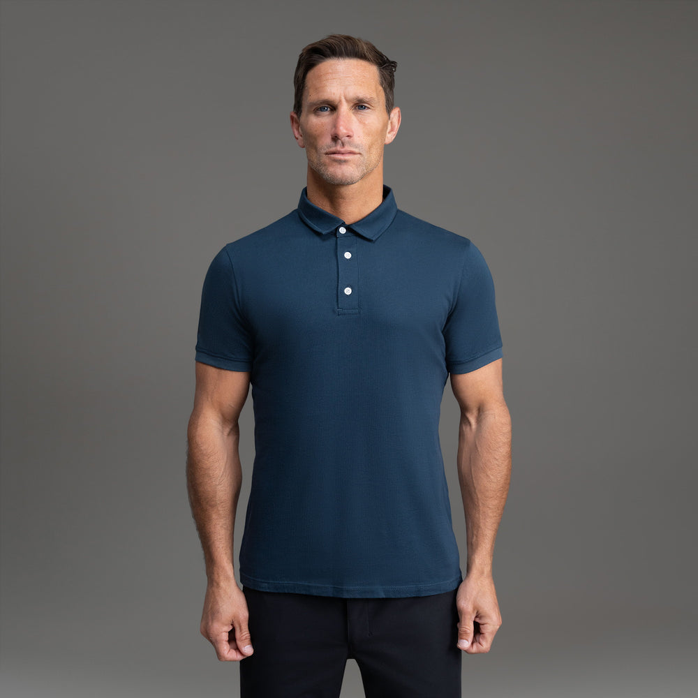 Dark navy polo shirt on a neutral background.
