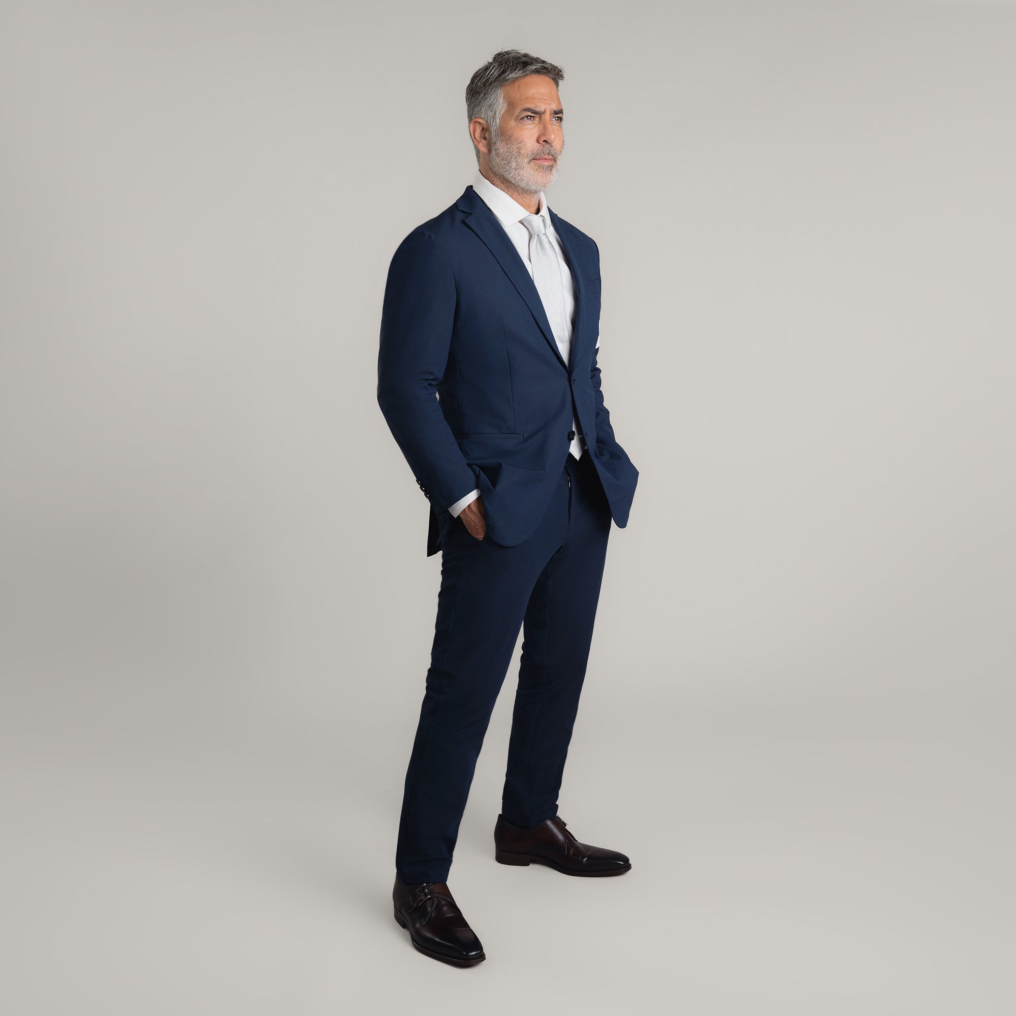 Tags:(5'11"|176 lbs)  Bespoke custom athleisure technical men's suit los angeles model Guillermo in Enso Navy