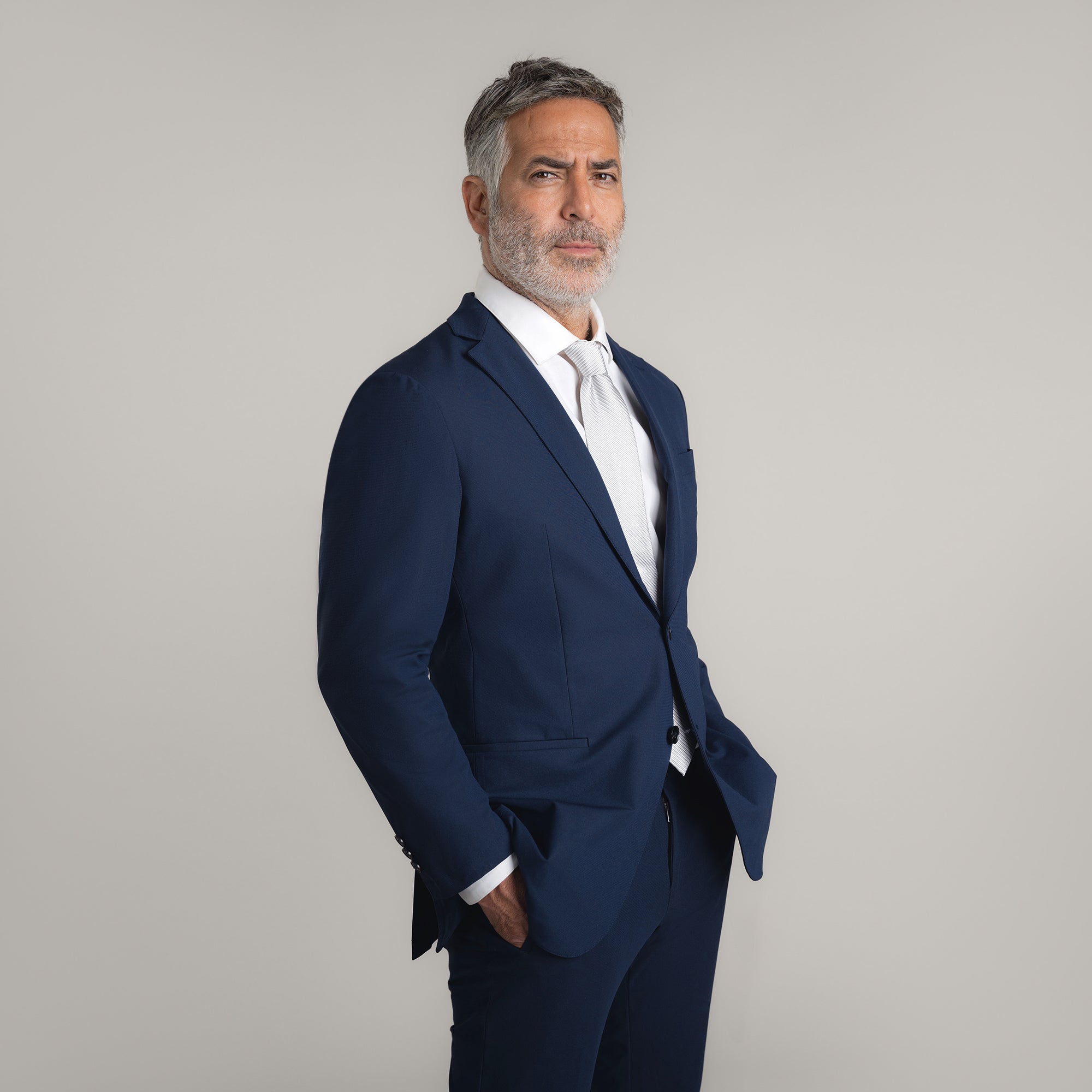 Tags:(5'11"|176 lbs)  Bespoke custom athleisure technical men's suit los angeles model Guillermo in Enso Navy