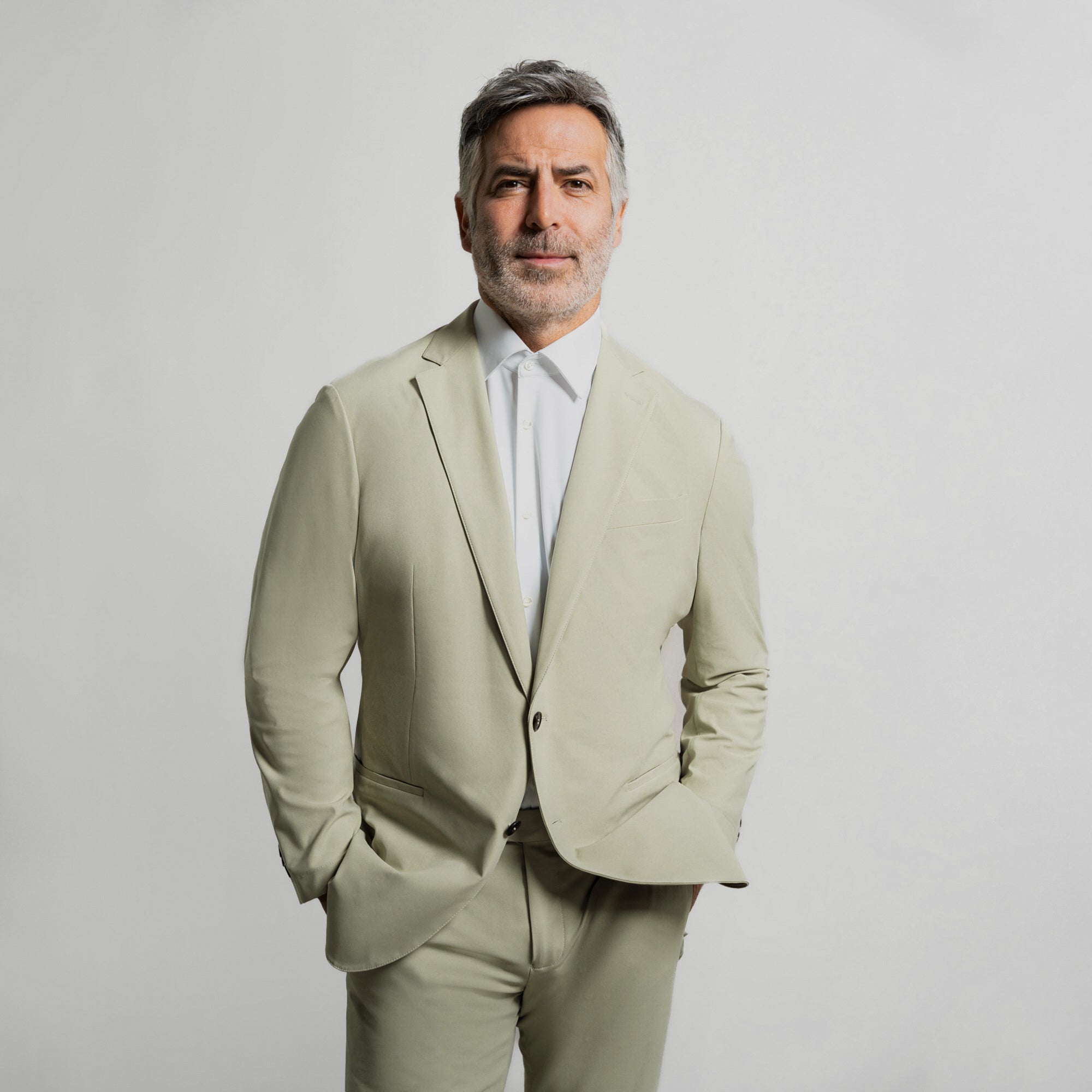 Bespoke custom athleisure technical athletic stretch suit los angeles model Guillermo in Absinthe