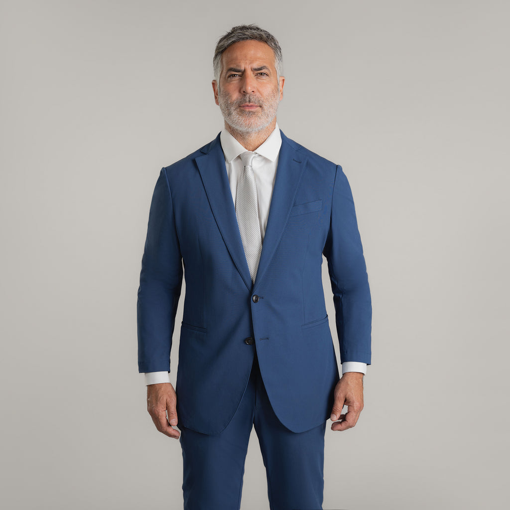 Tags:(5'11"|176 lbs) Bespoke custom athleisure technical athletic stretch suit los angeles model Guillermo in Italian Blue