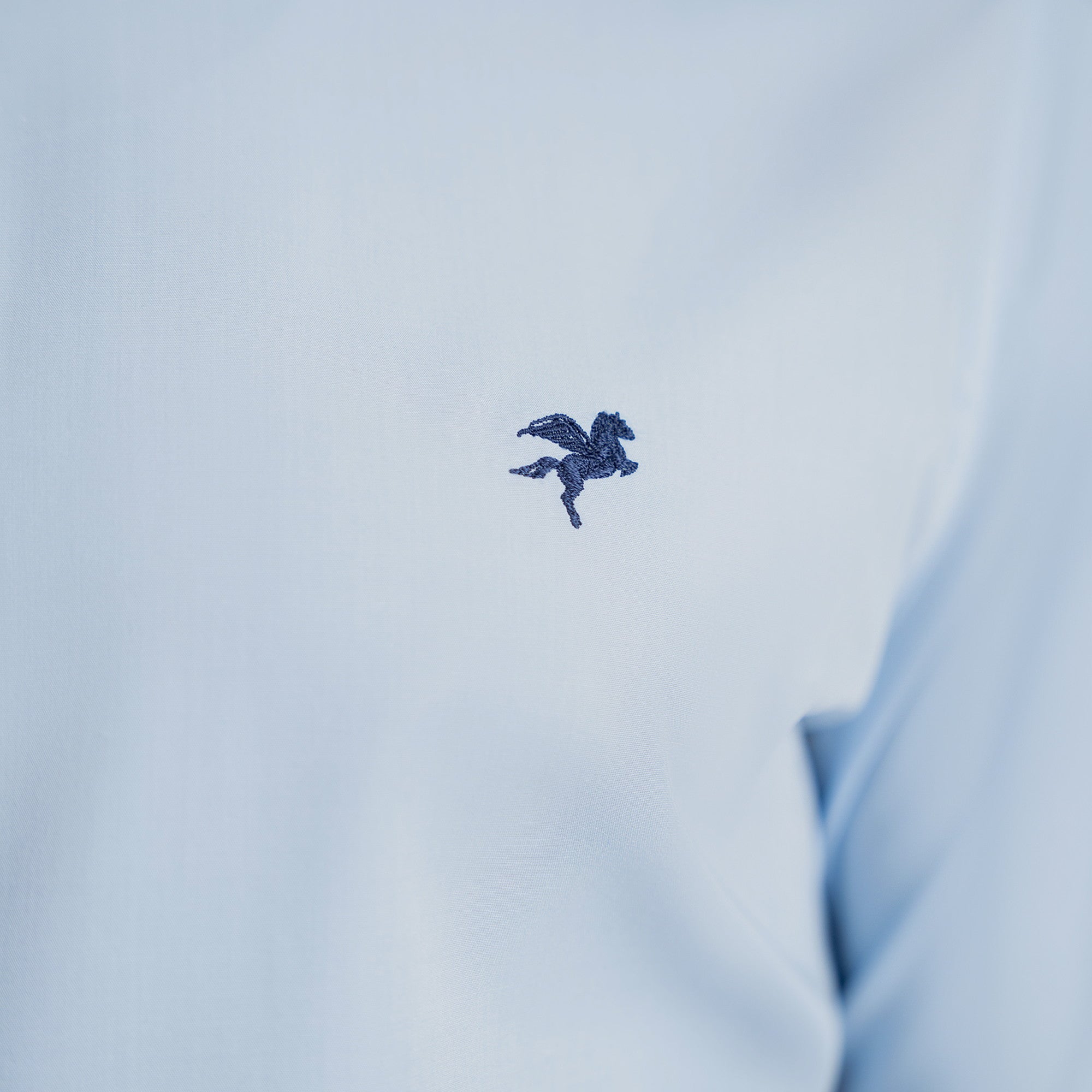 Custom Bespoke Tailored Spread Shirt model Tyler in Light Blue Emblem