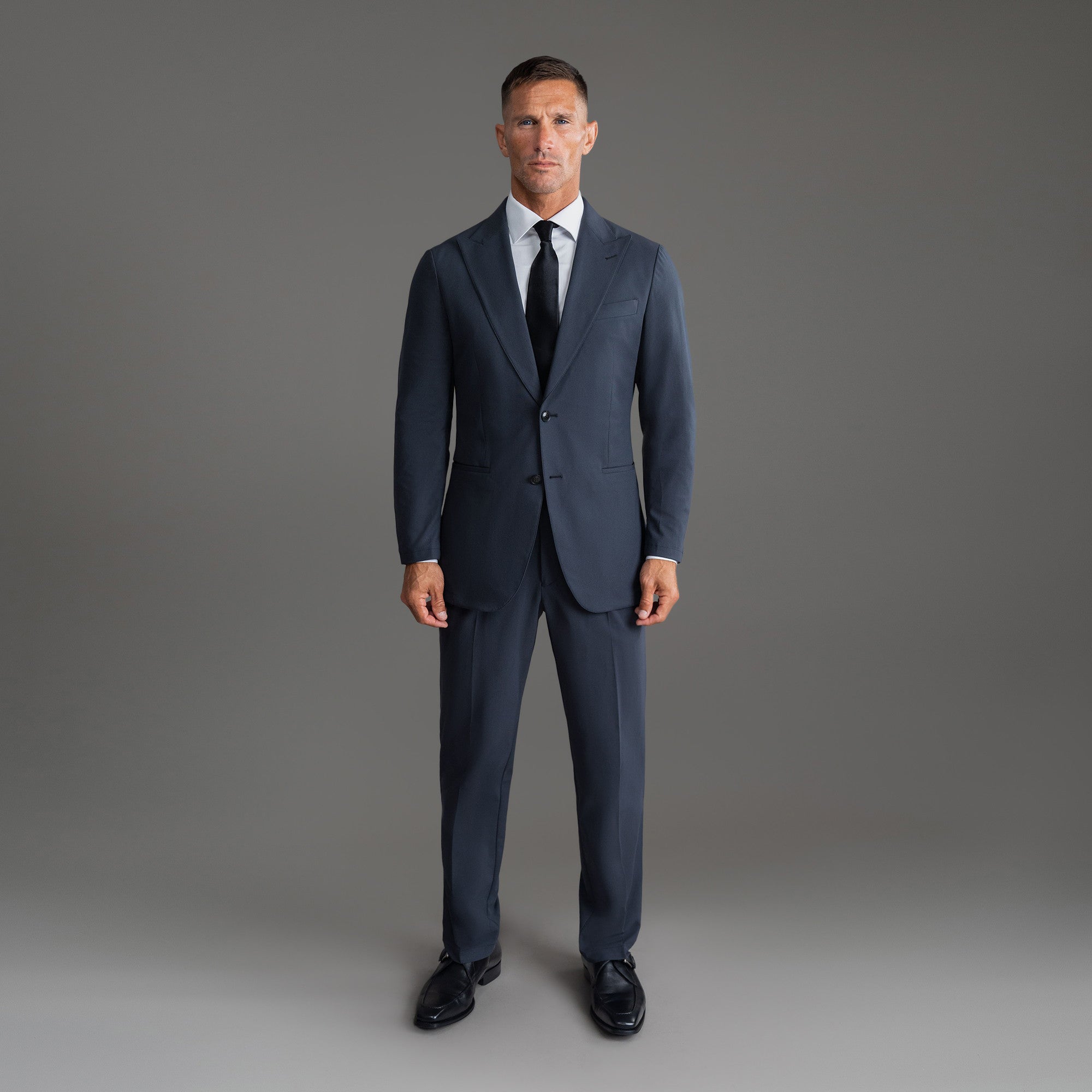 Custom Peak Lapel Tuxedo model Tyler in Charcoal