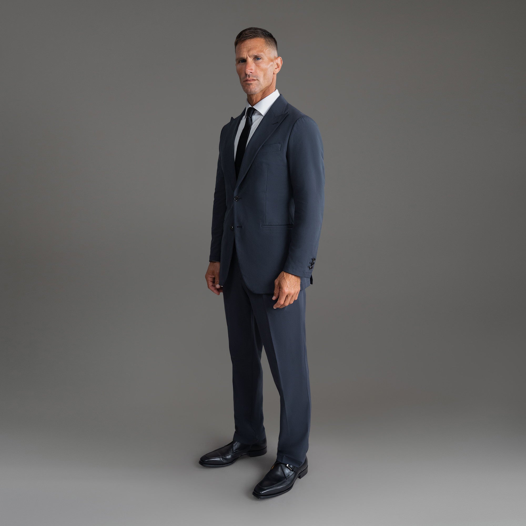 Custom Peak Lapel Tuxedo model Tyler in Charcoal