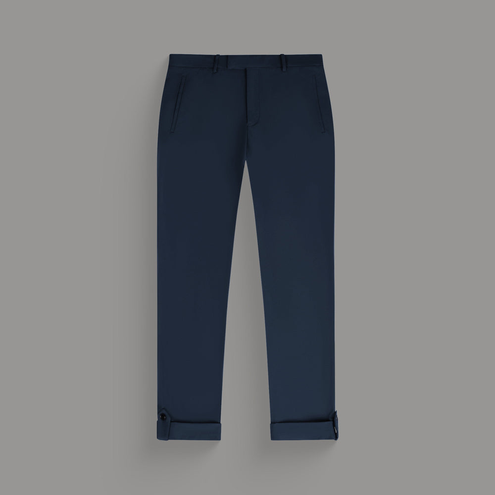 Black slim-fit trousers with adjustable cuffs on a gray background.