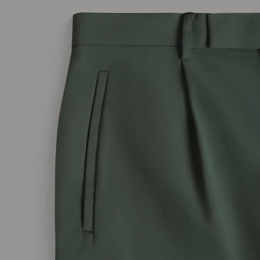 Dark green trousers close-up with side pocket and belt loop detail.