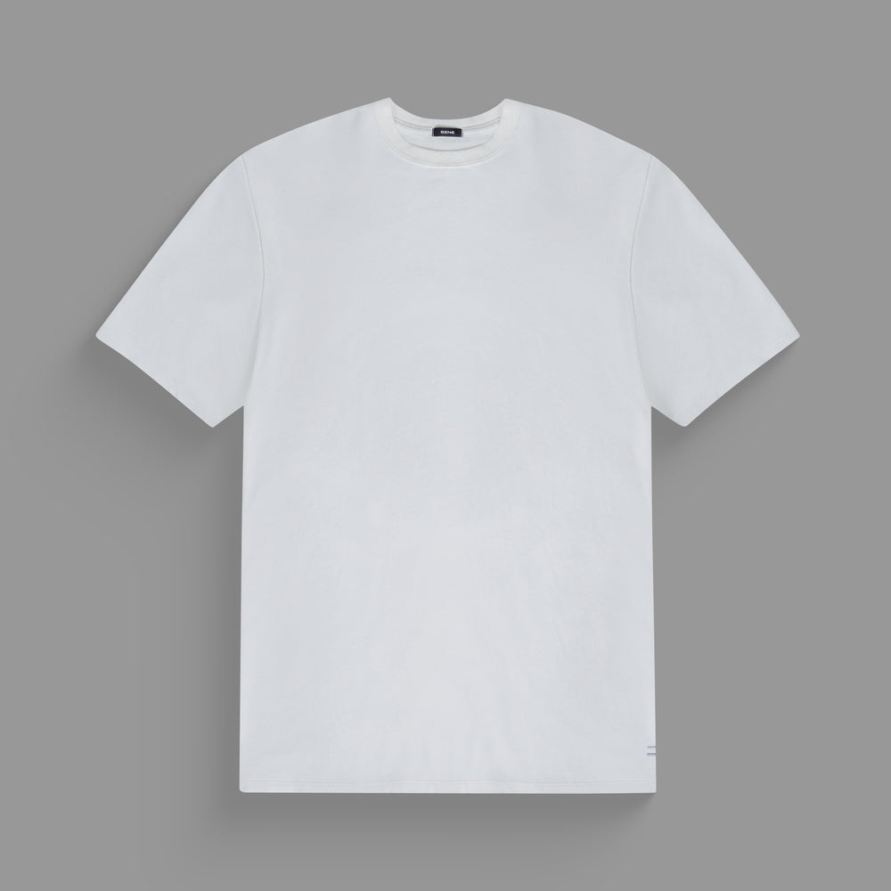 Plain white T-shirt on a grey background.