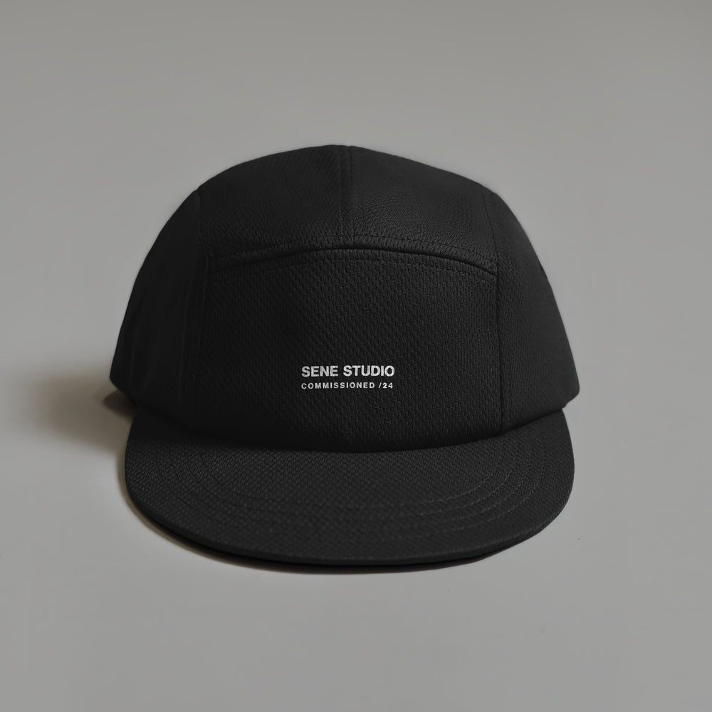 Black cap with 'Sene Studio Commissioned /24' text on front.