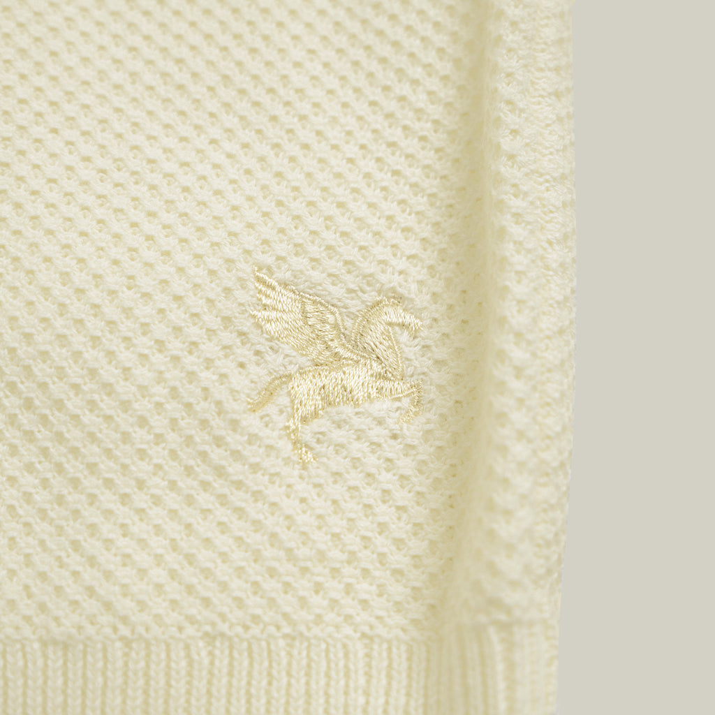 Buttonless Knit Polo model Tyler in Vanilla