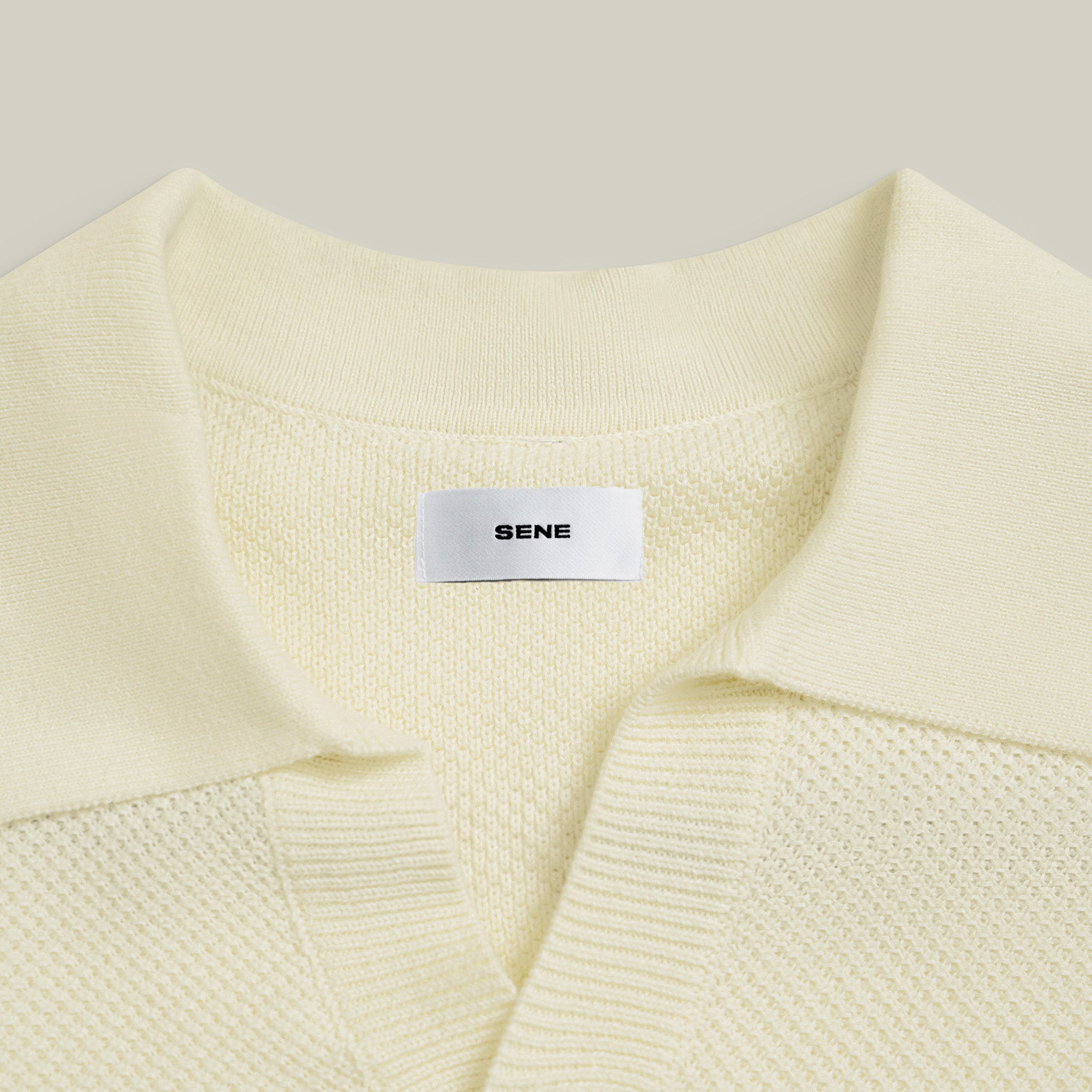 Buttonless Knit Polo model Tyler in Vanilla