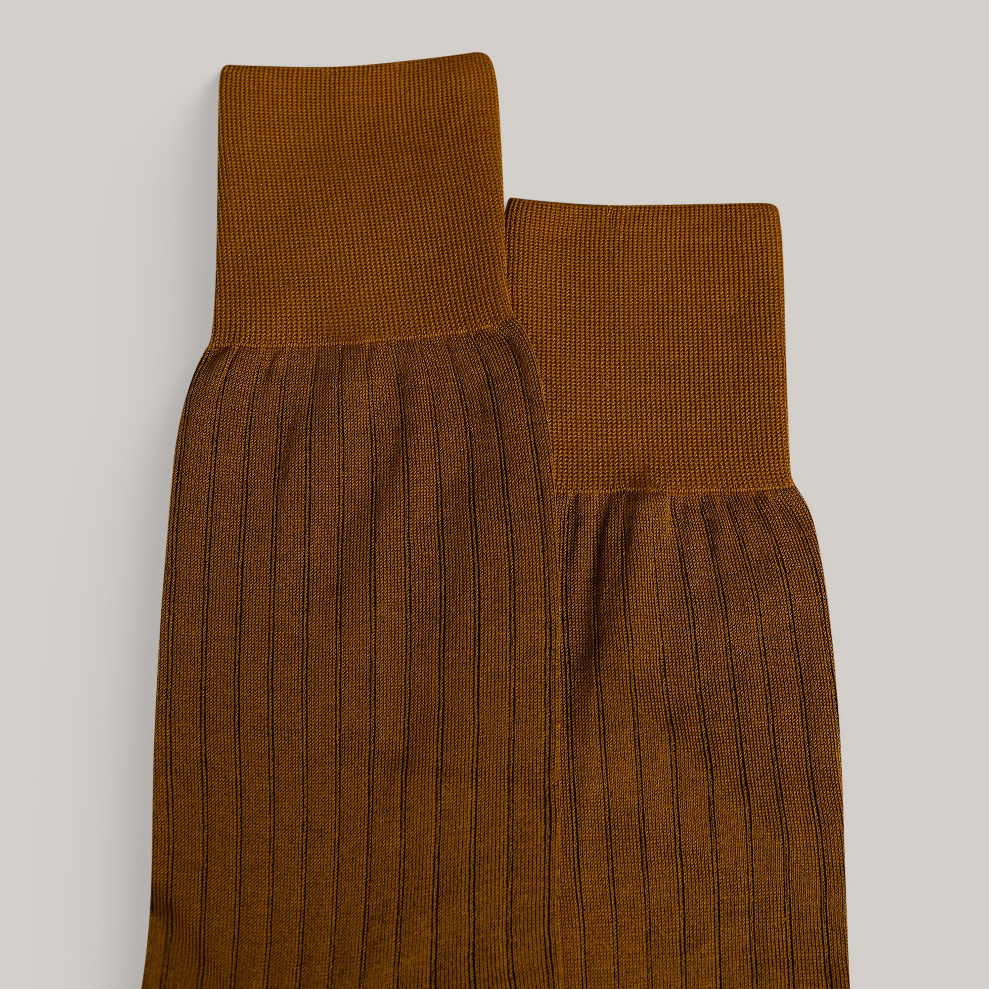 Sene Socks model flatlay in Burnt Orange