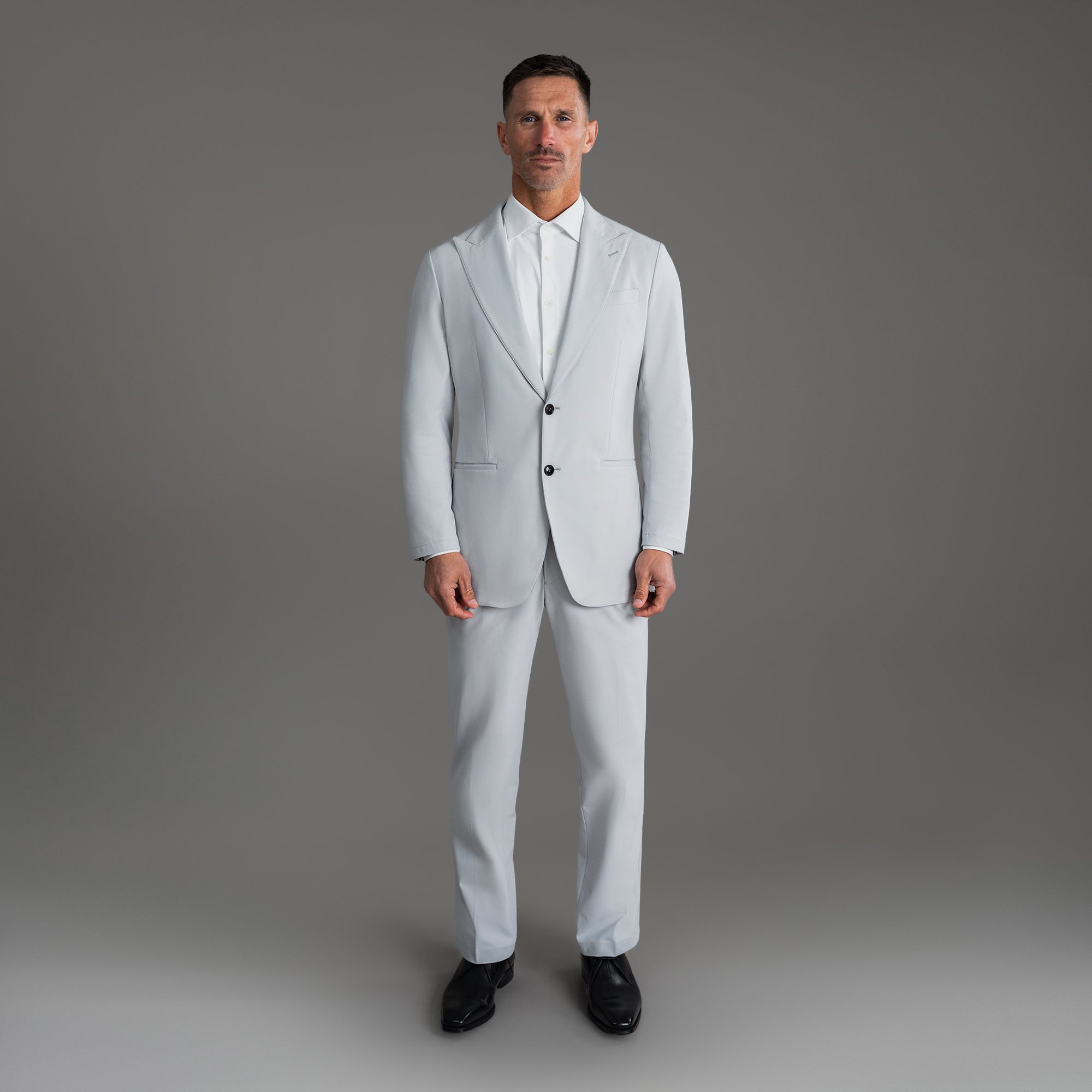 Custom Peak Lapel Tuxedo model Tyler in Silver
