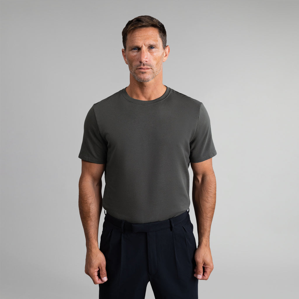 Ten t-shirts in White, Smoke, Frost Gray, Deep Sea, Black a beige background model Tyler in Best-Seller