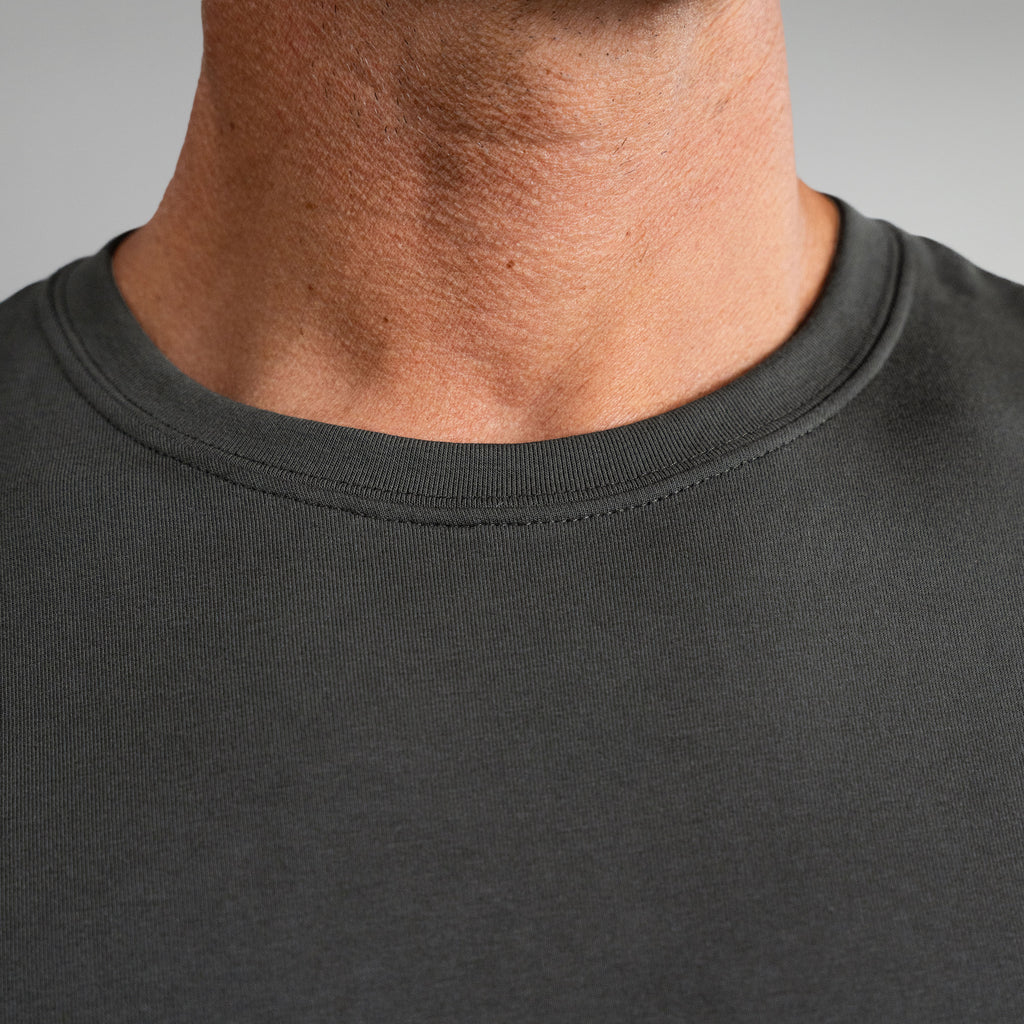 Ten t-shirts in White, Smoke, Frost Gray, Deep Sea, Black a beige background model Tyler in Best-Seller