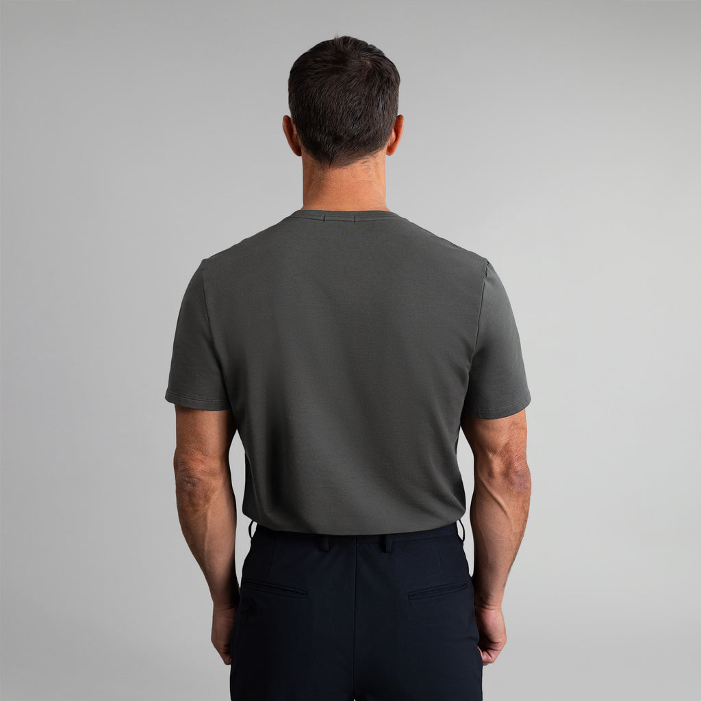 Ten t-shirts in White, Smoke, Frost Gray, Deep Sea, Black a beige background model Tyler in Best-Seller