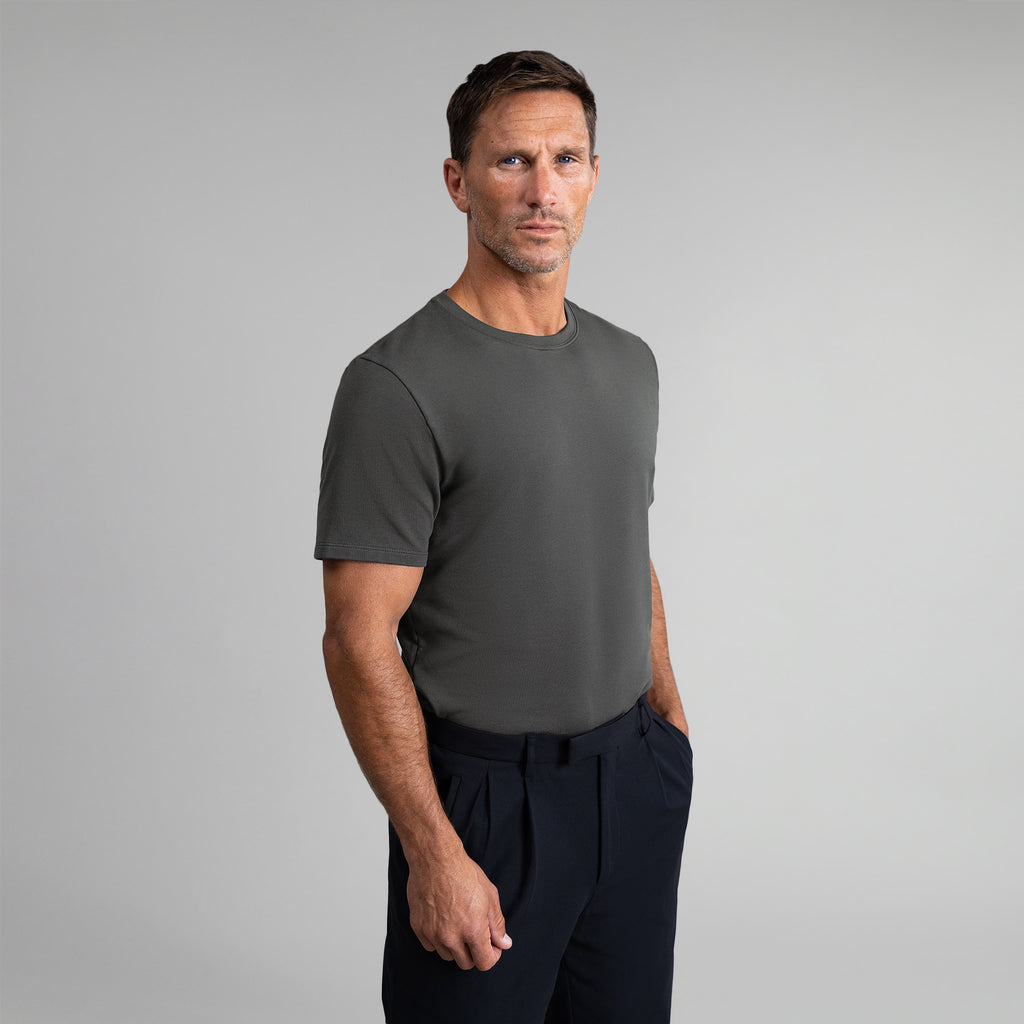 Ten t-shirts in White, Smoke, Frost Gray, Deep Sea, Black a beige background model Tyler in Best-Seller