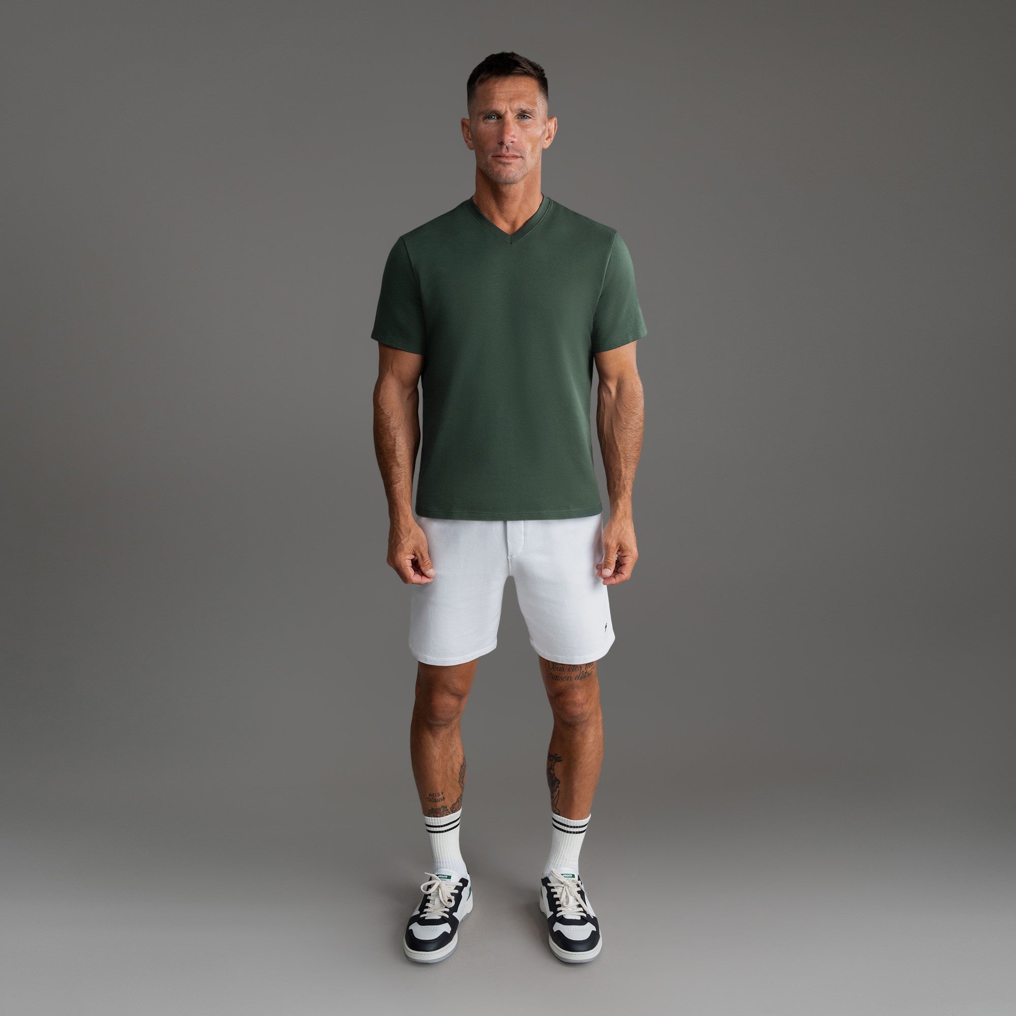 Cumulus v-neck t-shirt on a beige background model Tyler in Best-Seller