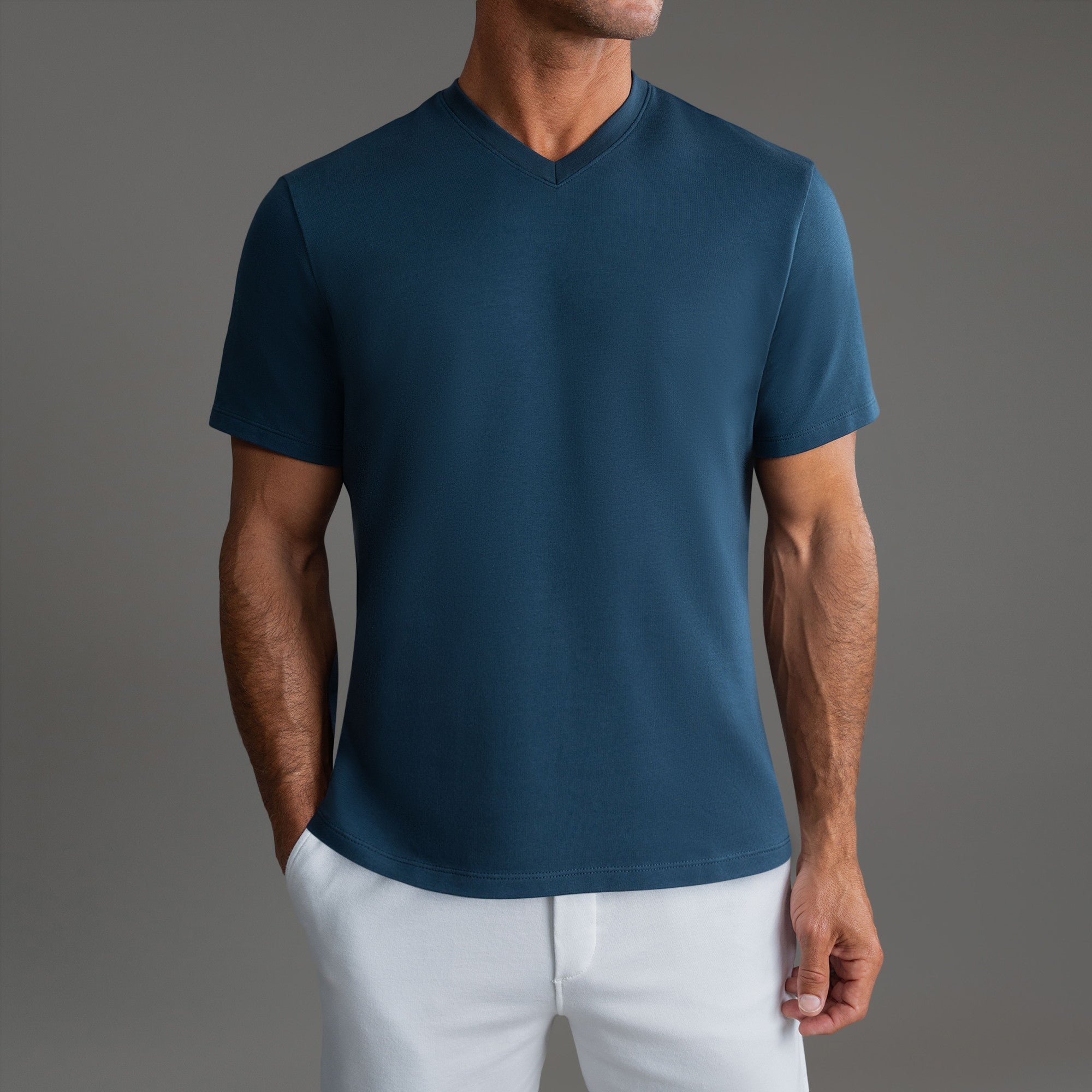 Cumulus v-neck t-shirt on a beige background model Tyler in Shade