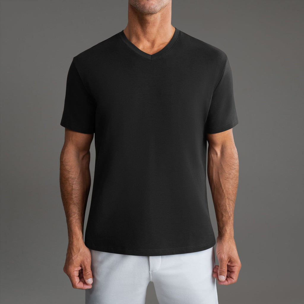 Cumulus v-neck t-shirt on a beige background model Tyler in Shade