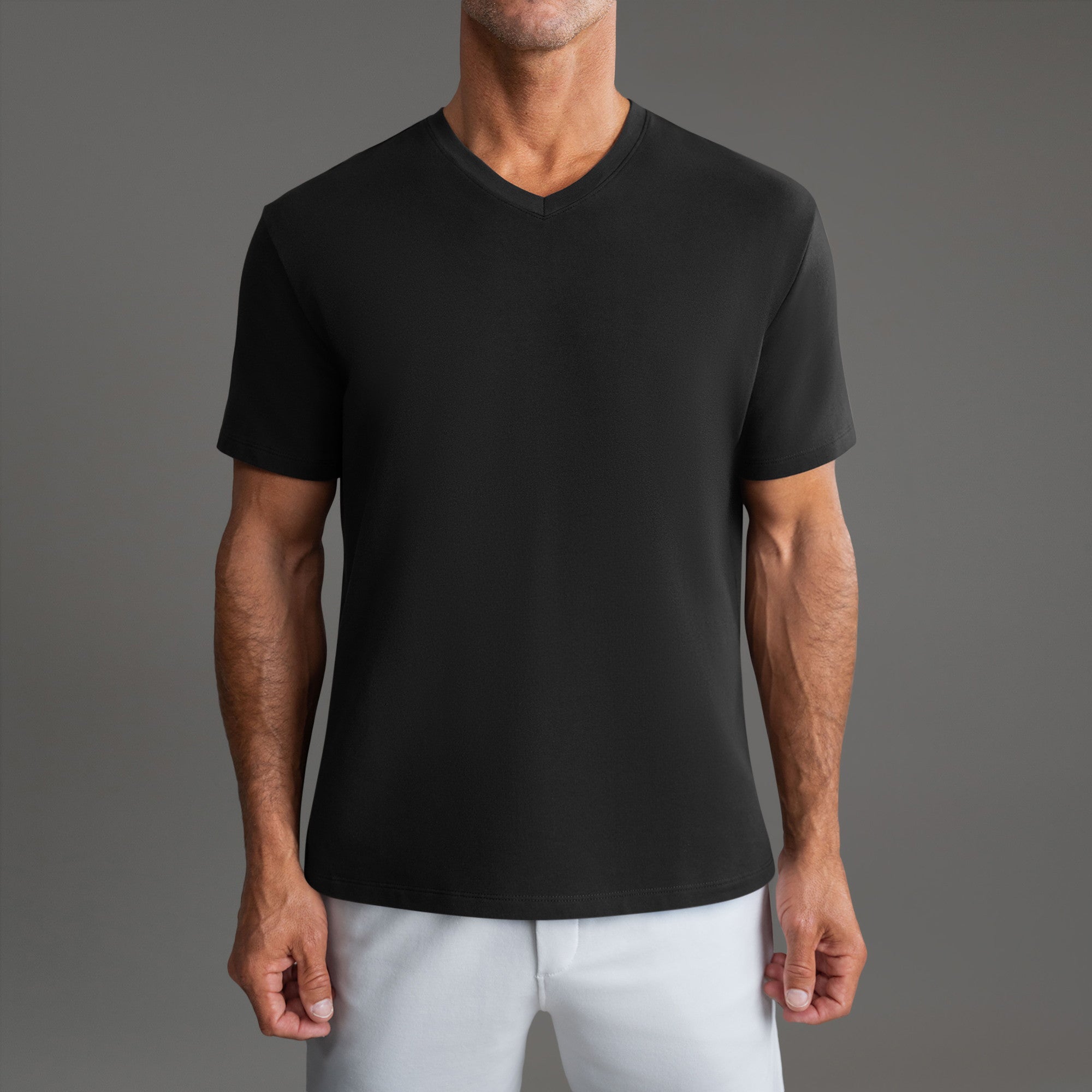Cumulus v-neck t-shirt on a beige background model Tyler in Minimalist