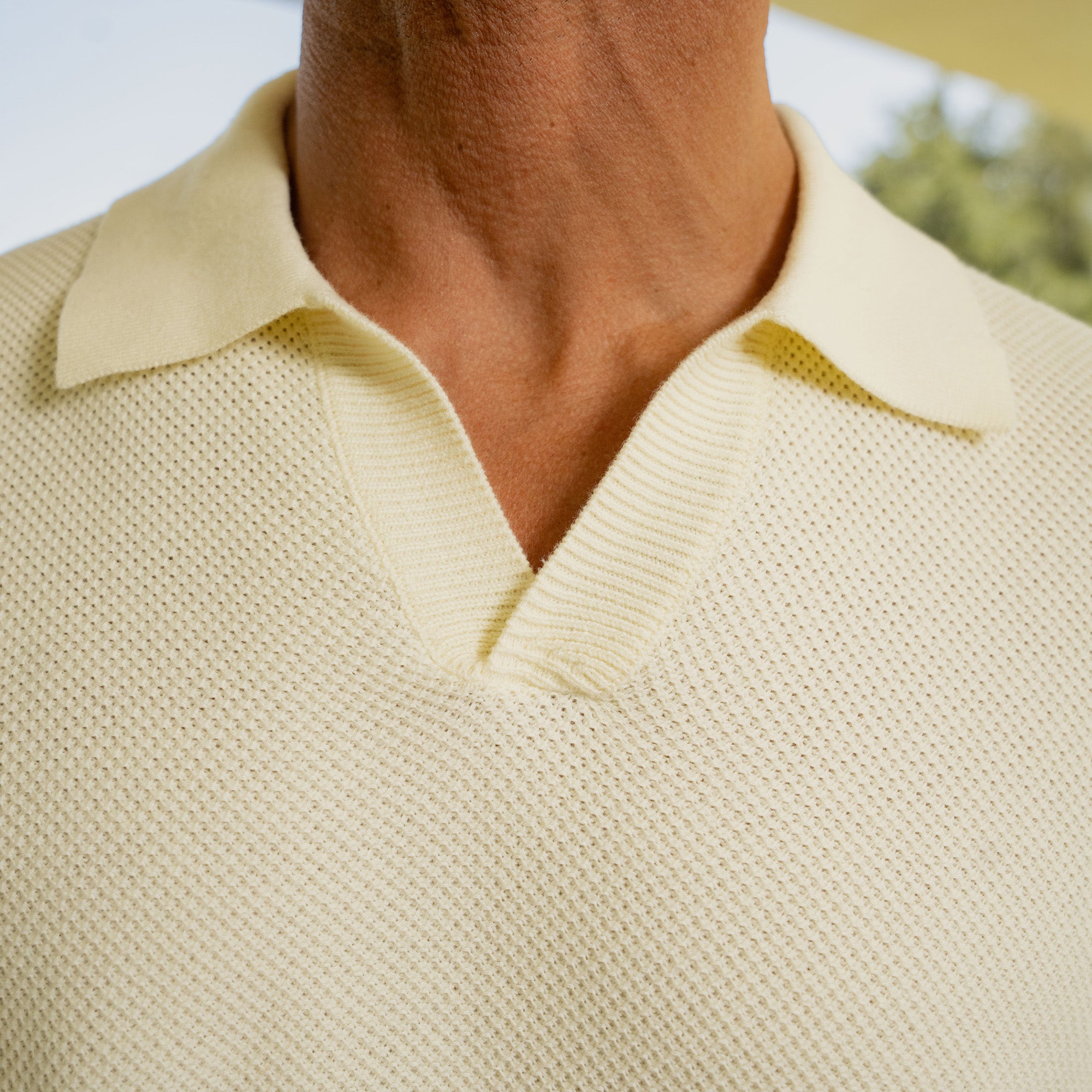 Buttonless Knit Polo model Tyler in Vanilla