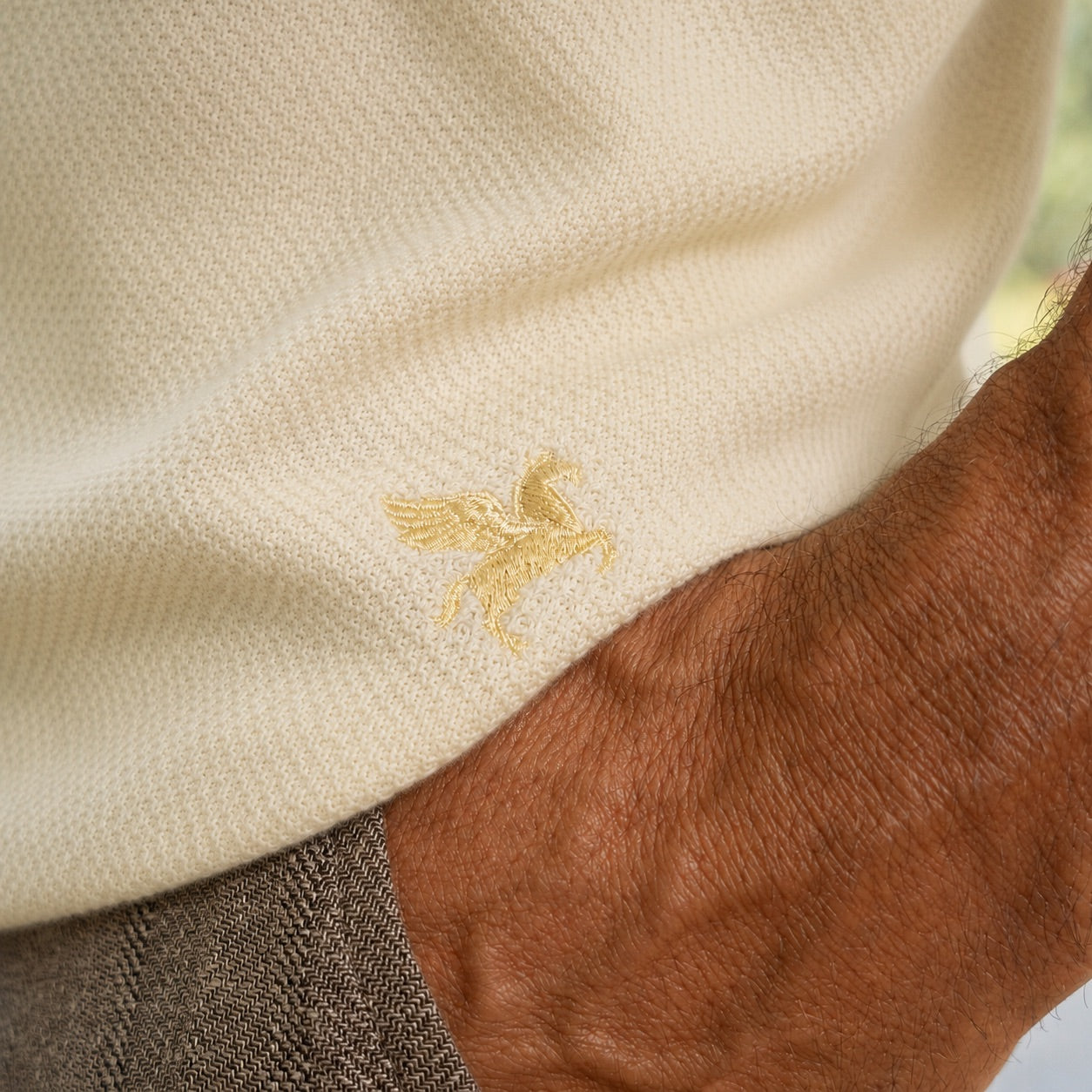 Buttonless Knit Polo model Tyler in Vanilla