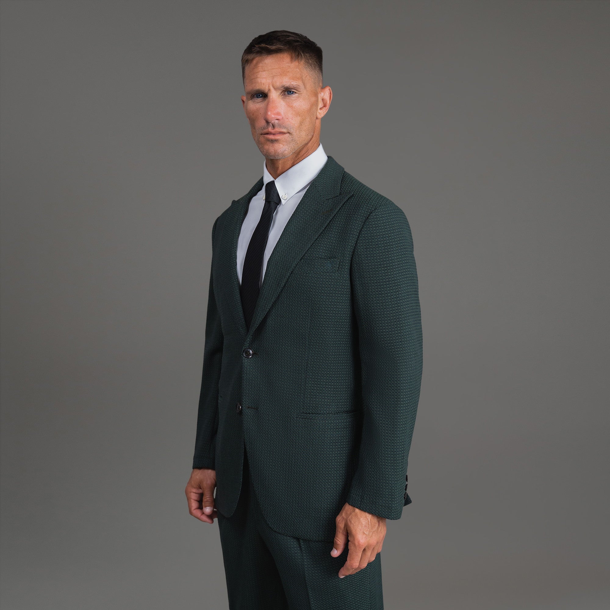 Bespoke custom athleisure technical athletic stretch suit los angeles model Tyler in Moss