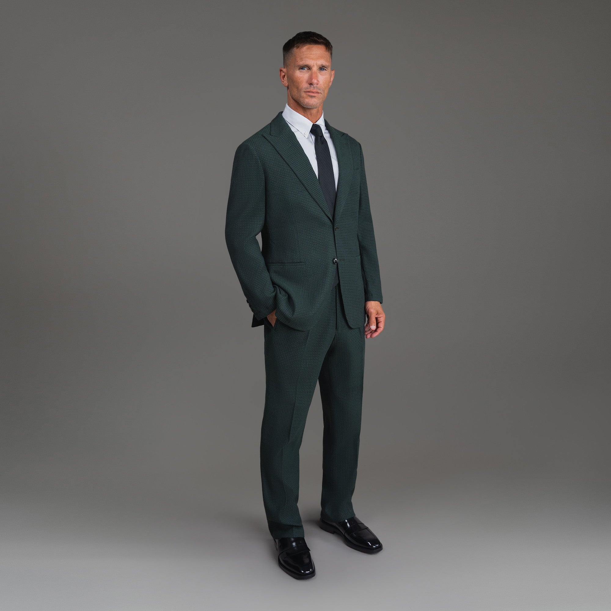 Bespoke custom athleisure technical athletic stretch suit los angeles model Tyler in Moss