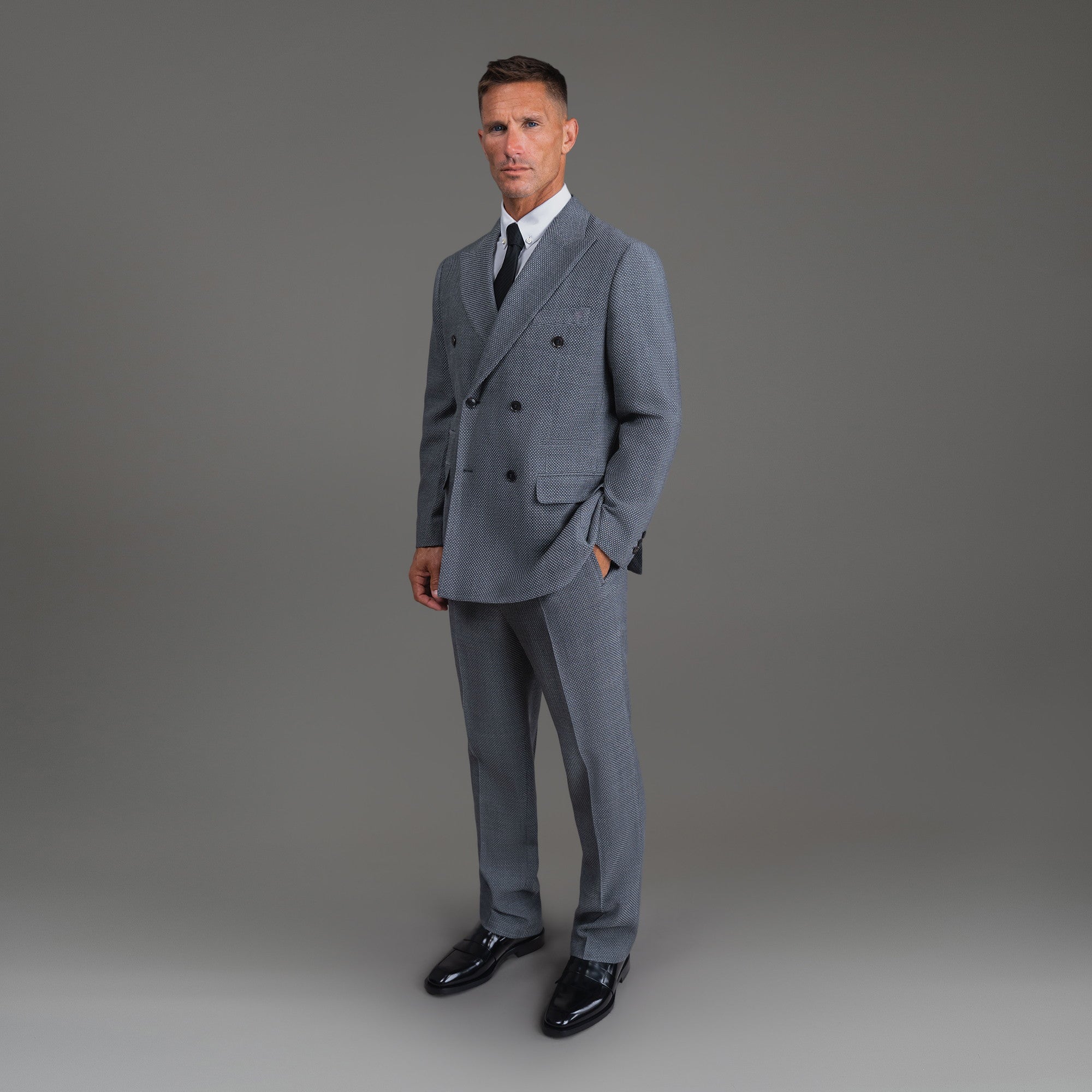 Bespoke custom athleisure technical athletic stretch suit los angeles model Tyler in Silver