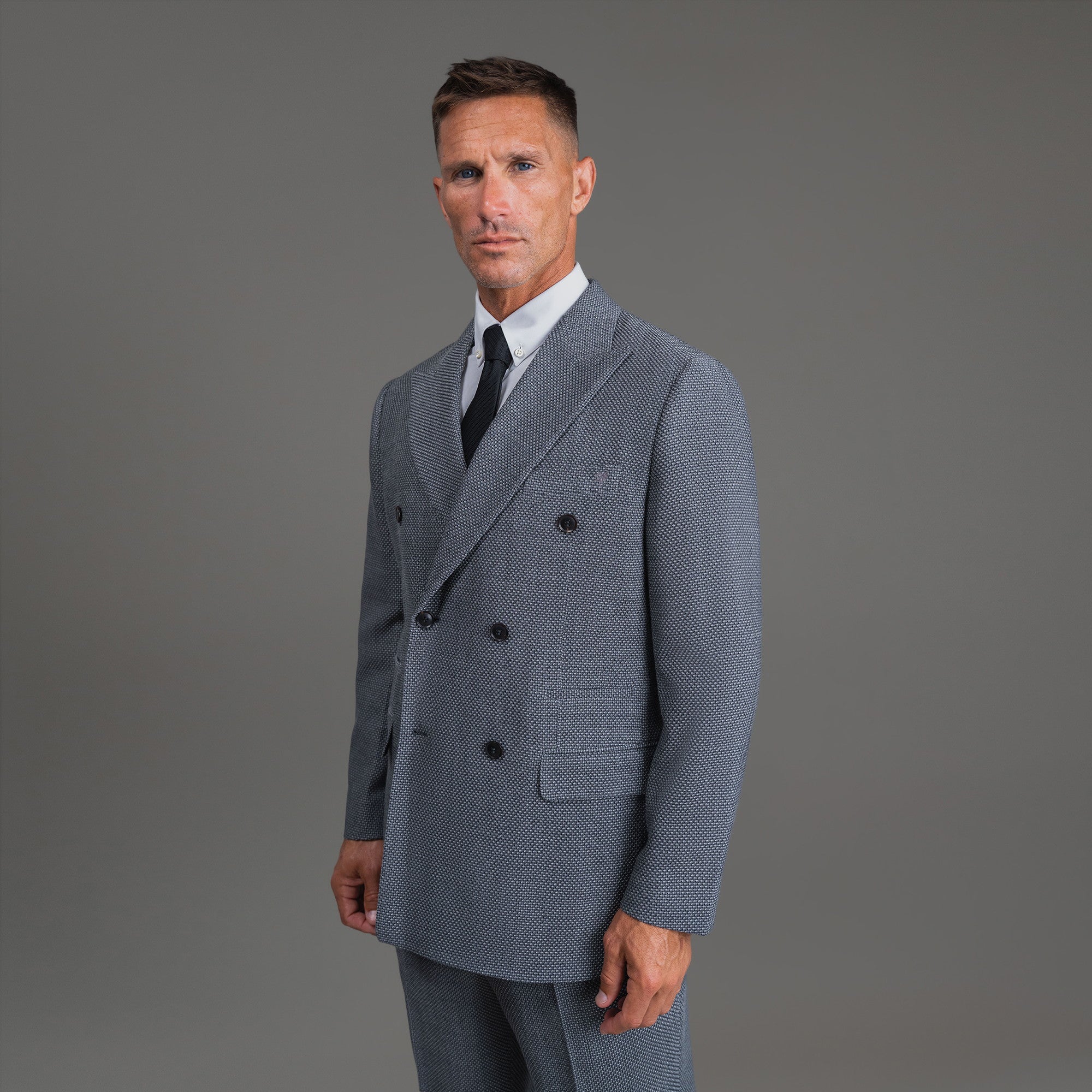 Bespoke custom athleisure technical athletic stretch suit los angeles model Tyler in Silver