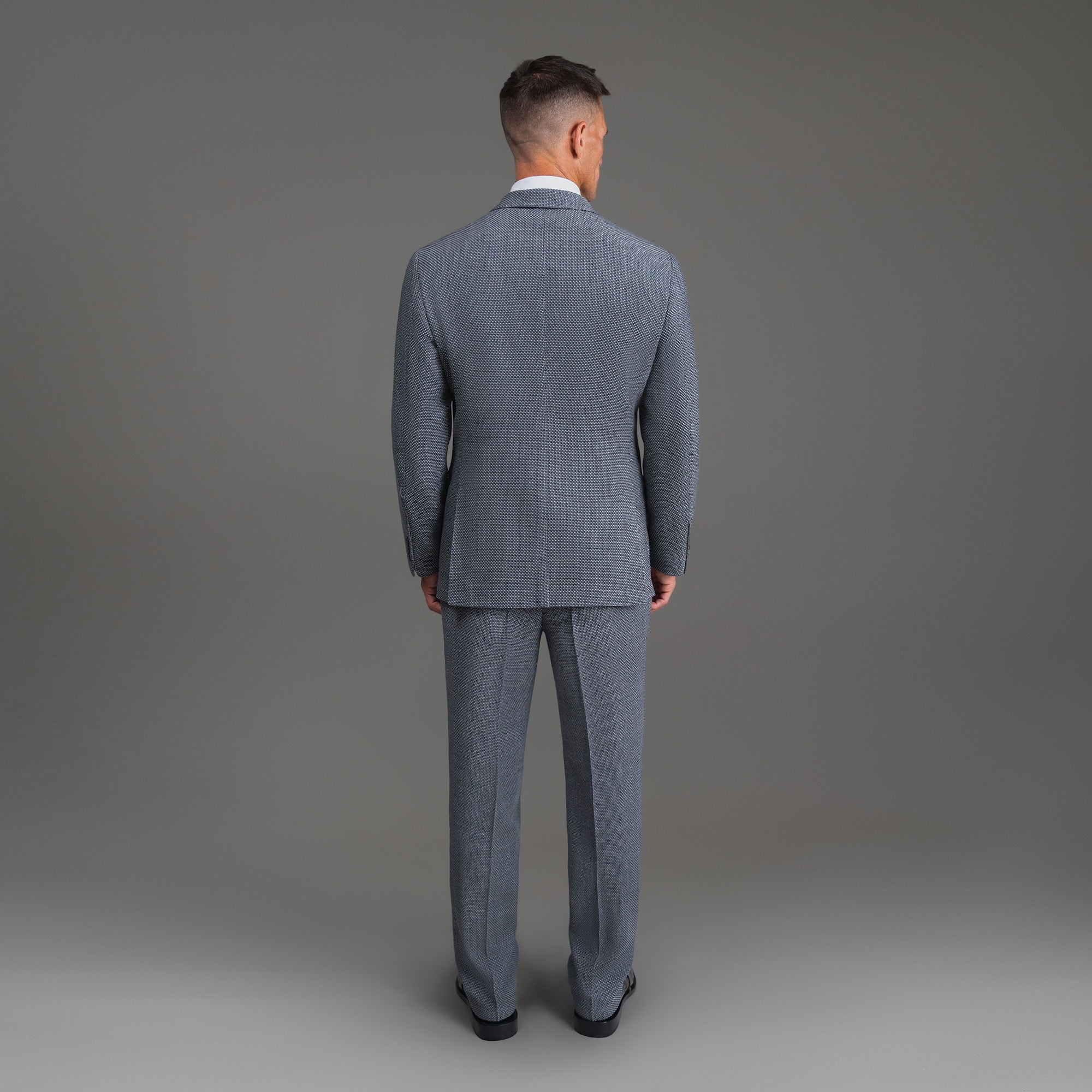 Bespoke custom athleisure technical athletic stretch suit los angeles model Tyler in Silver