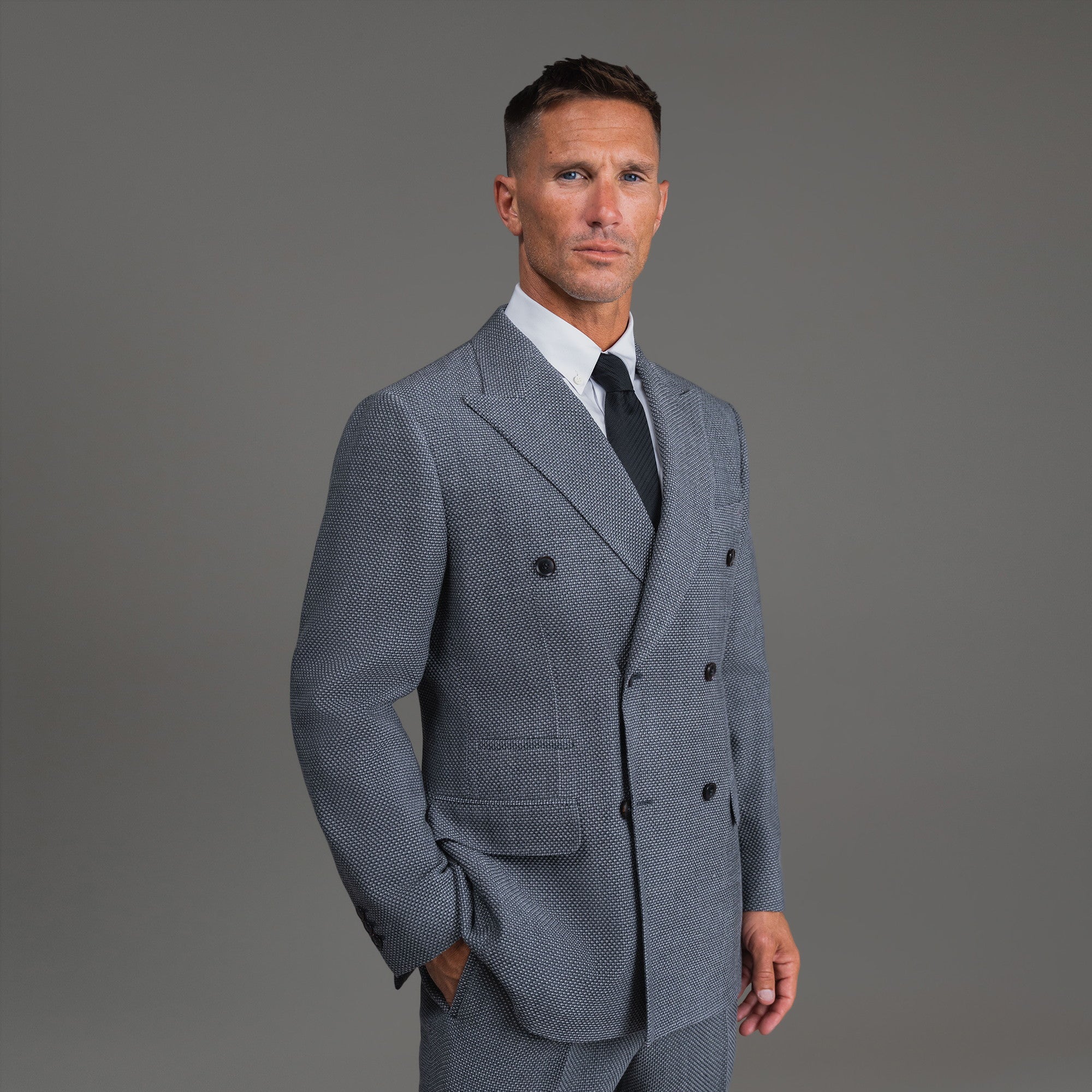 Bespoke custom athleisure technical athletic stretch suit los angeles model Tyler in Silver