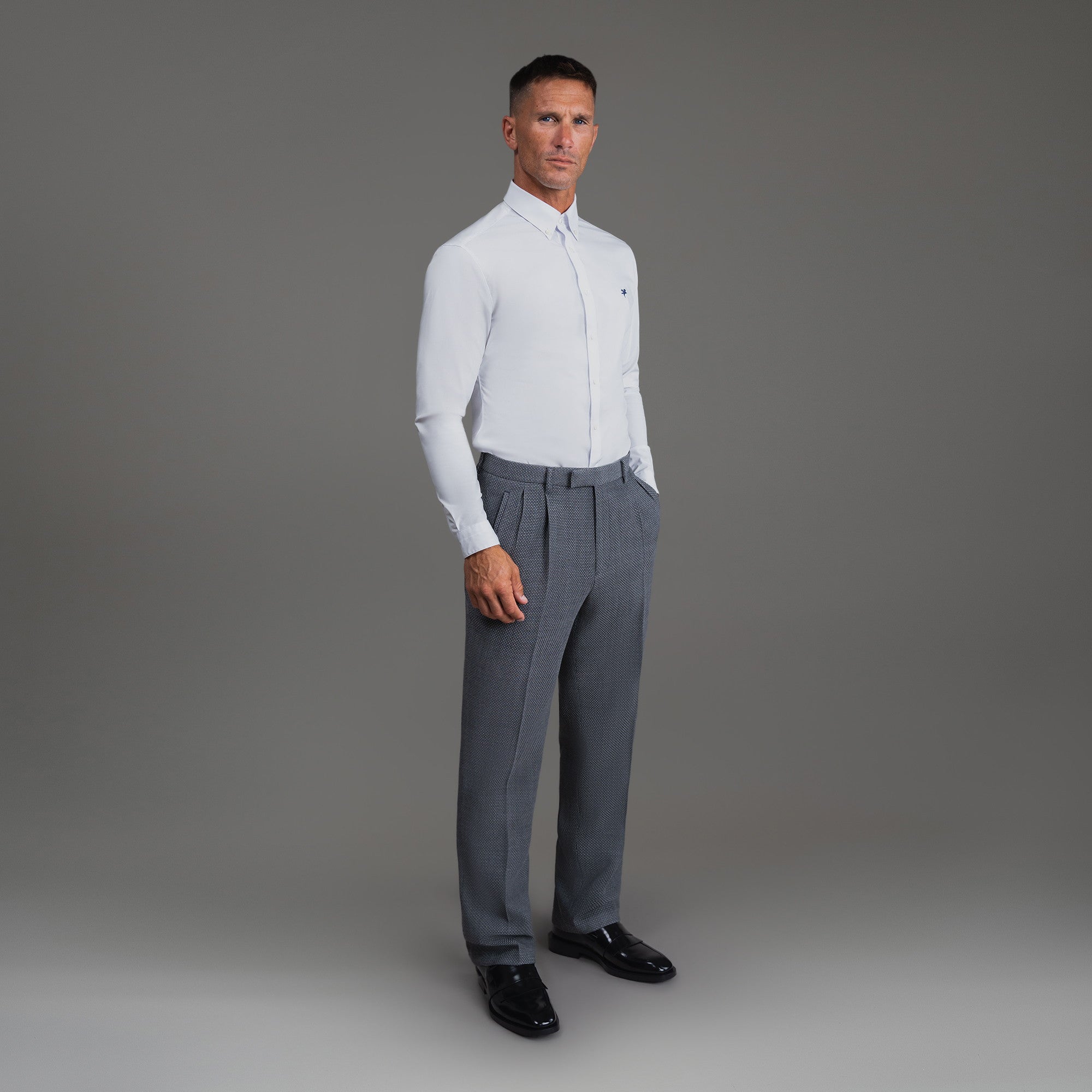 Bespoke custom athleisure technical athletic stretch suit los angeles model Tyler in Silver