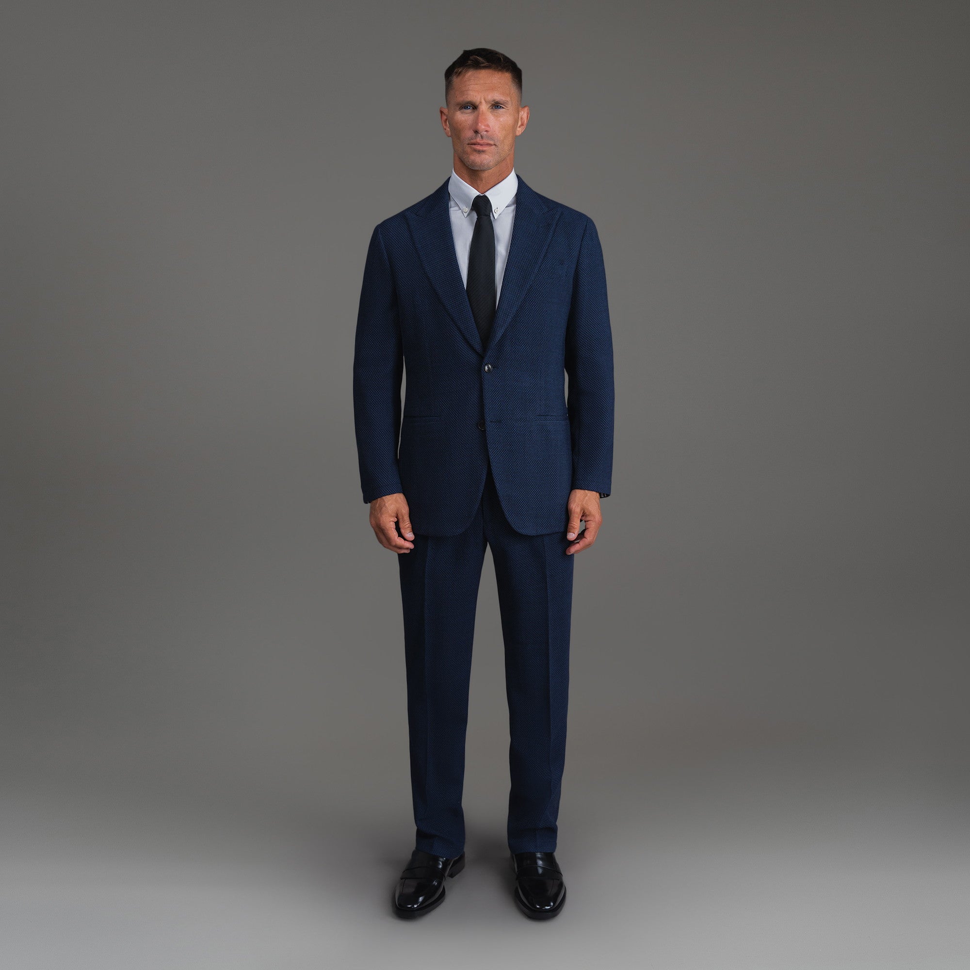 Bespoke custom athleisure technical athletic stretch suit los angeles model Tyler in Navy